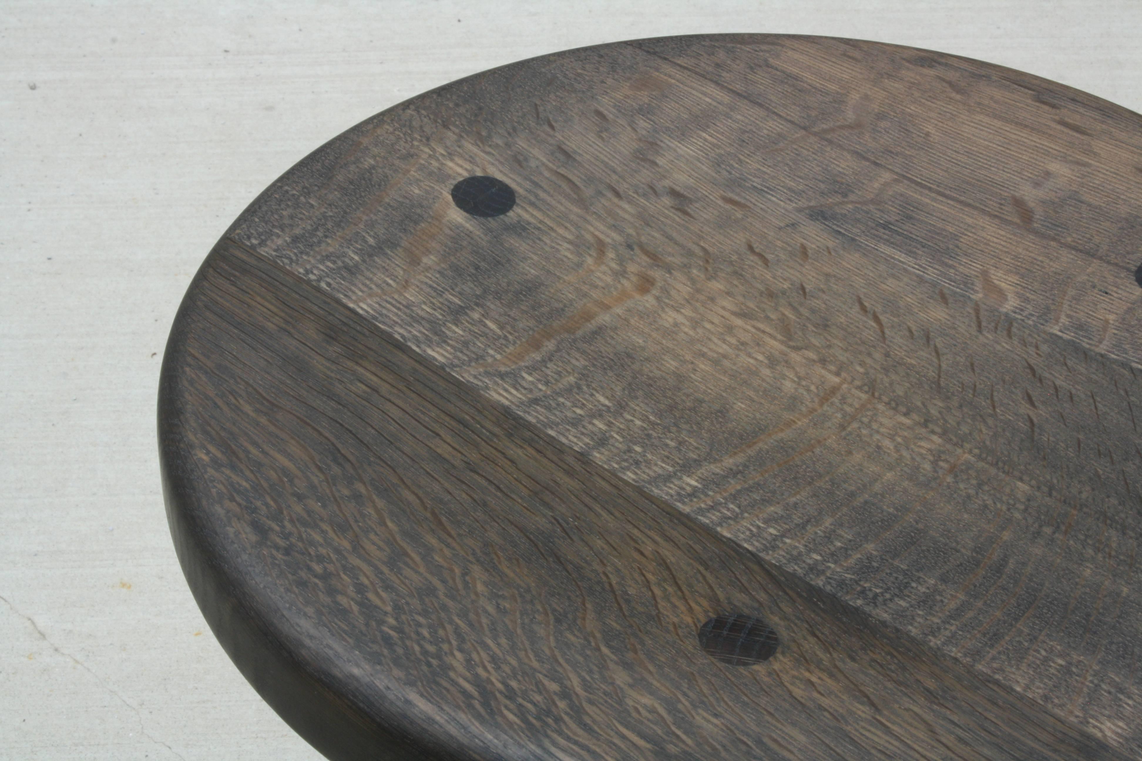 American Saddle, Handmade Oxidized Oak Stool with Textured Legs and a Carved Seat For Sale