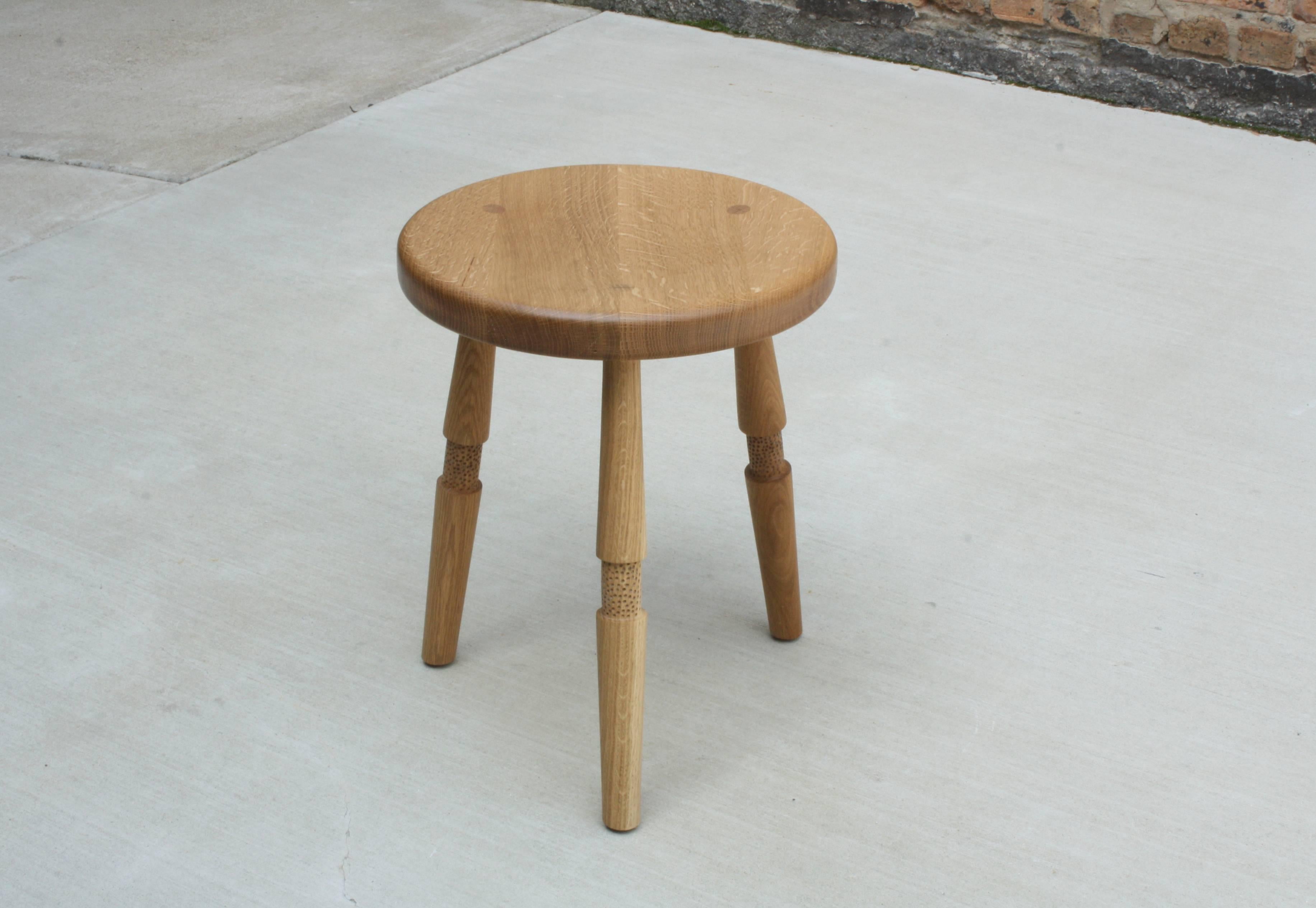 Saddle, Handmade Oxidized Oak Stool with Textured Legs and a Carved Seat For Sale 1