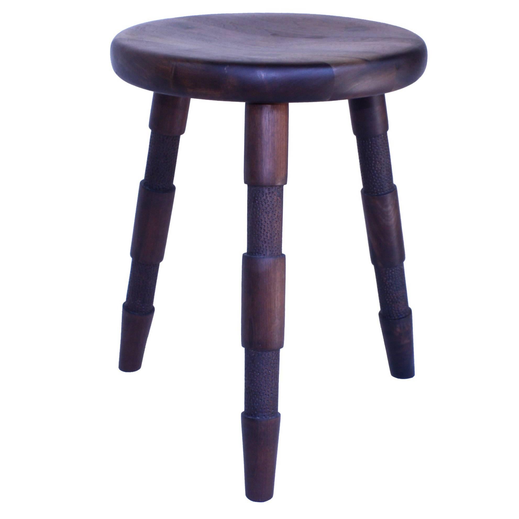 Saddle, Handmade Wood Stool With Textured Legs and a Carved Seat For Sale