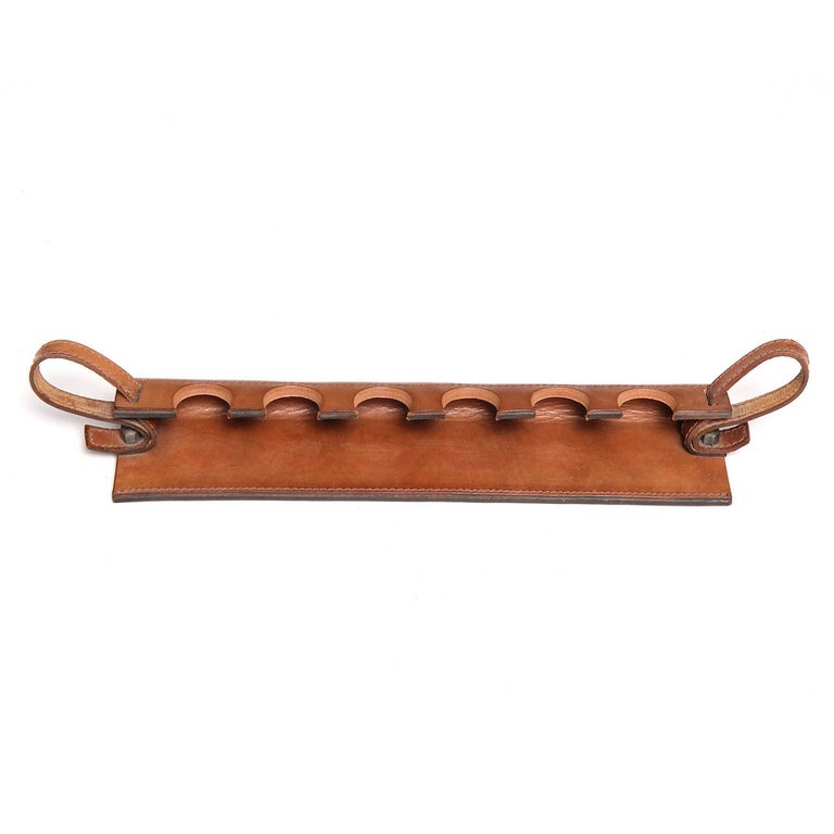 A beautifully hand crafted pipe cradle made of rich, oiled and stitched saddle leather.