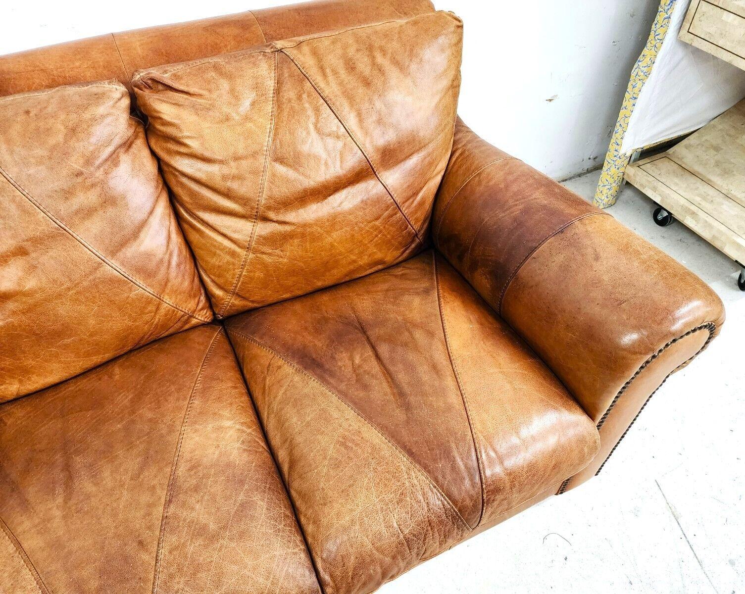 tan leather love seat