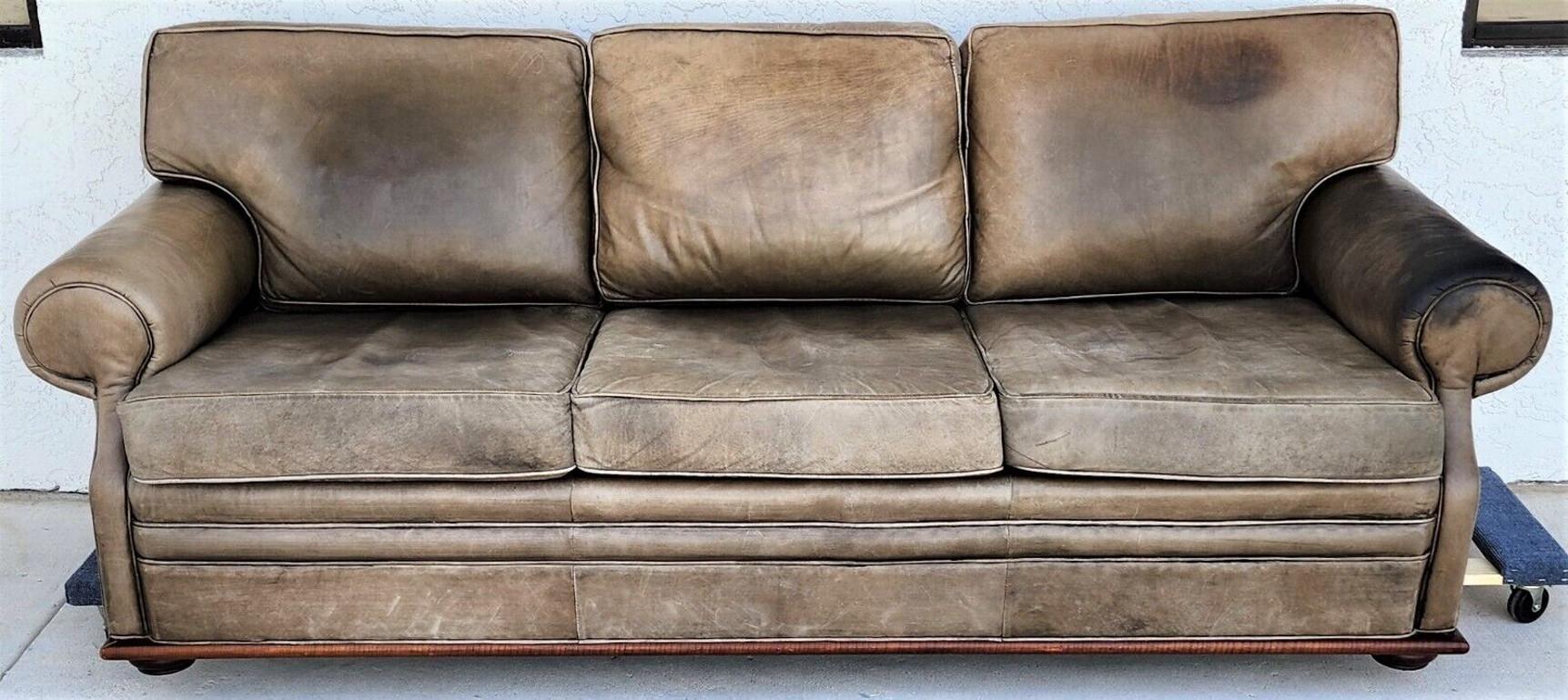 For FULL item description click on CONTINUE READING at the bottom of this page.

Offering One Of Our Recent Palm Beach Estate Fine Furniture Acquisitions Of A
Vintage 1970s Classic Saddle Leather Sofa by RALPH LAUREN

Approximate Measurements