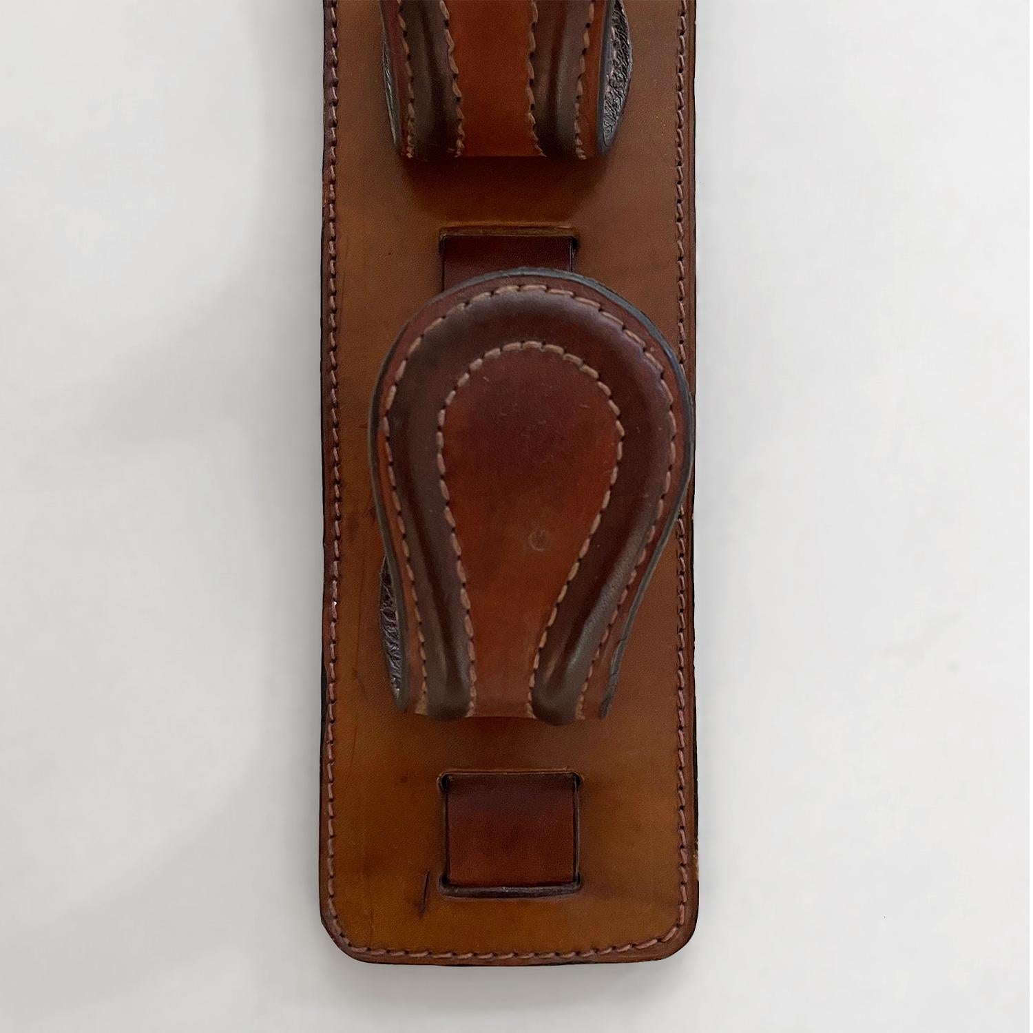 French Saddle Leather Wall Hooks in the style of Jacques Adnet In Good Condition For Sale In Los Angeles, CA