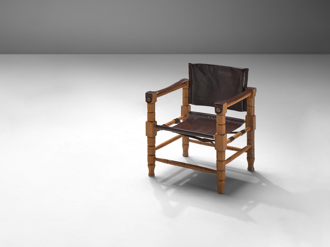 Safari chair, stained beech, leather, metal, Europe, 1970s

A safari chair made in beech and leather, manufactured in Europe in the 1970s. This design is very robust yet stately in its appearance. This design features a wonderfully carved wooden