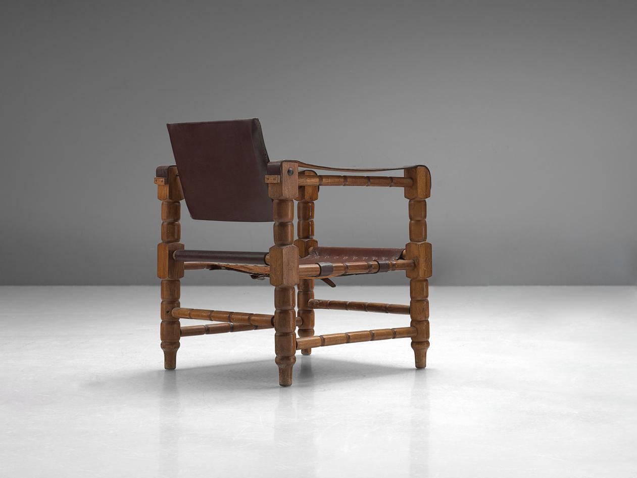 European Safari Armchair in Brown Leather with Sculptural Wooden Frame For Sale