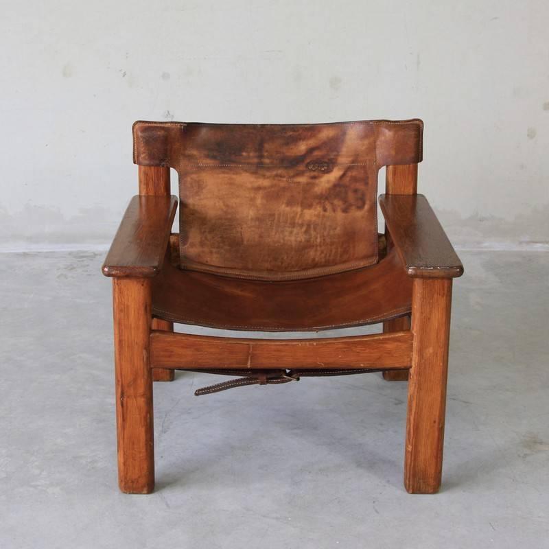 Lounge chair designed by Bernt Petersen, Sweden, 1970.

Comfortable 'Safari' chair with dark pine frame and well used ox hide seat and backrest.

Bernt Petersen, often known simply as Bernt, was a Danish furniture designer. Trained as a