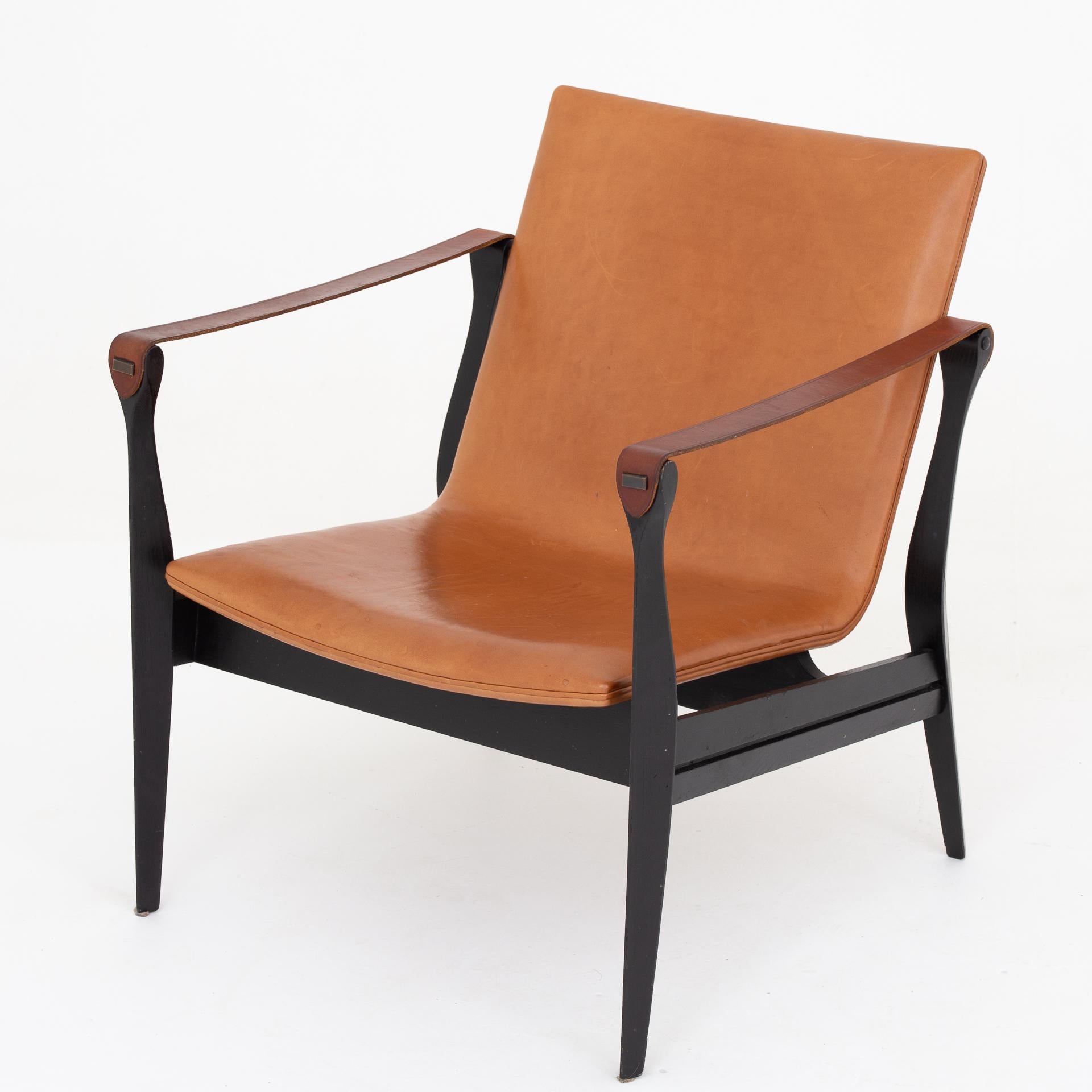 Model 4305, Safari chair in black ash with patinated cognac-colored leather. Maker Fritz Hansen.