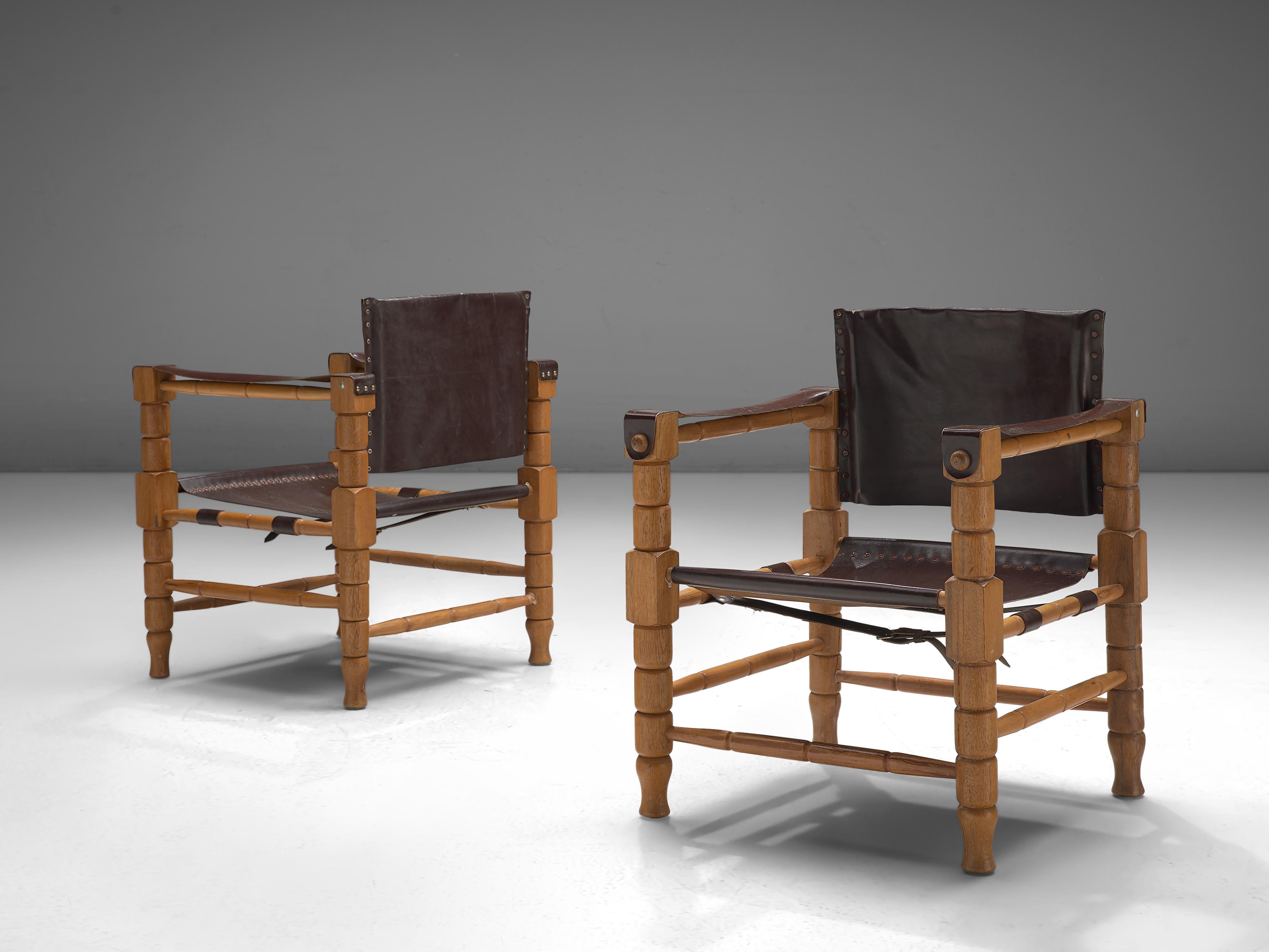 Safari chair, beech, leather, Europe, 1940s

Robust yet stately safari chairs with a rich patina. These chairs feature wonderfully carved wooden frames, with sculpted forms. The frame holds the leather straps that function as armrests and the