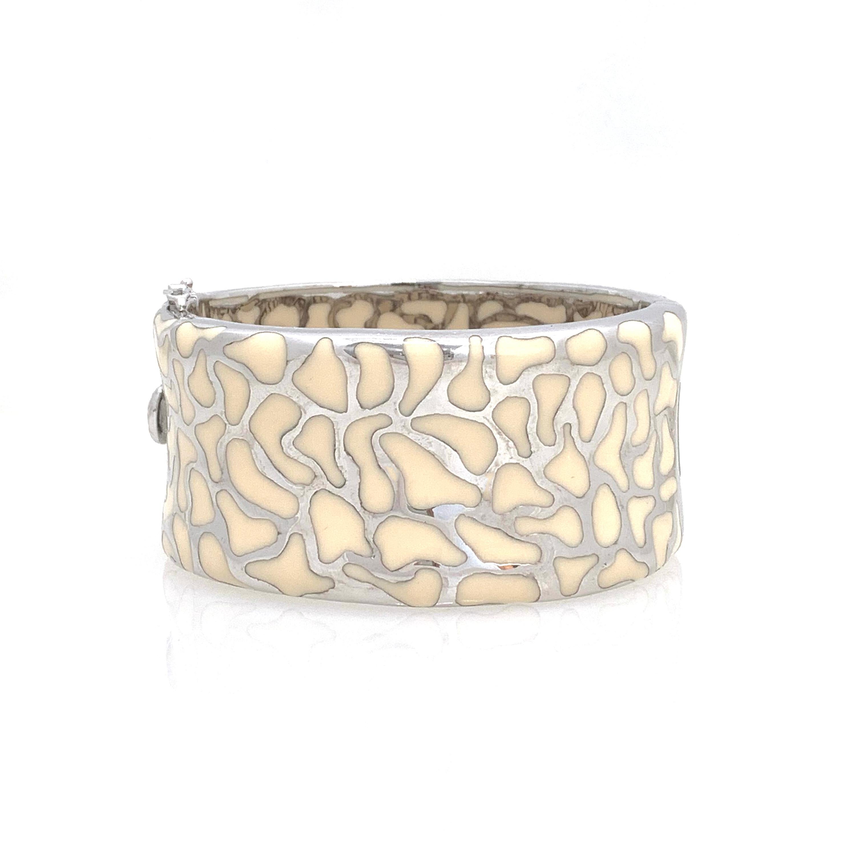 Fabulous safari print enamel sterling silver wide cuff bracelet. This beautiful handmade enamel in safari pattern. The base metal is platinum rhodium plated sterling silver. Push clasp and ‘8’ safety lock. 

The bracelet measures  1-3/8” width.