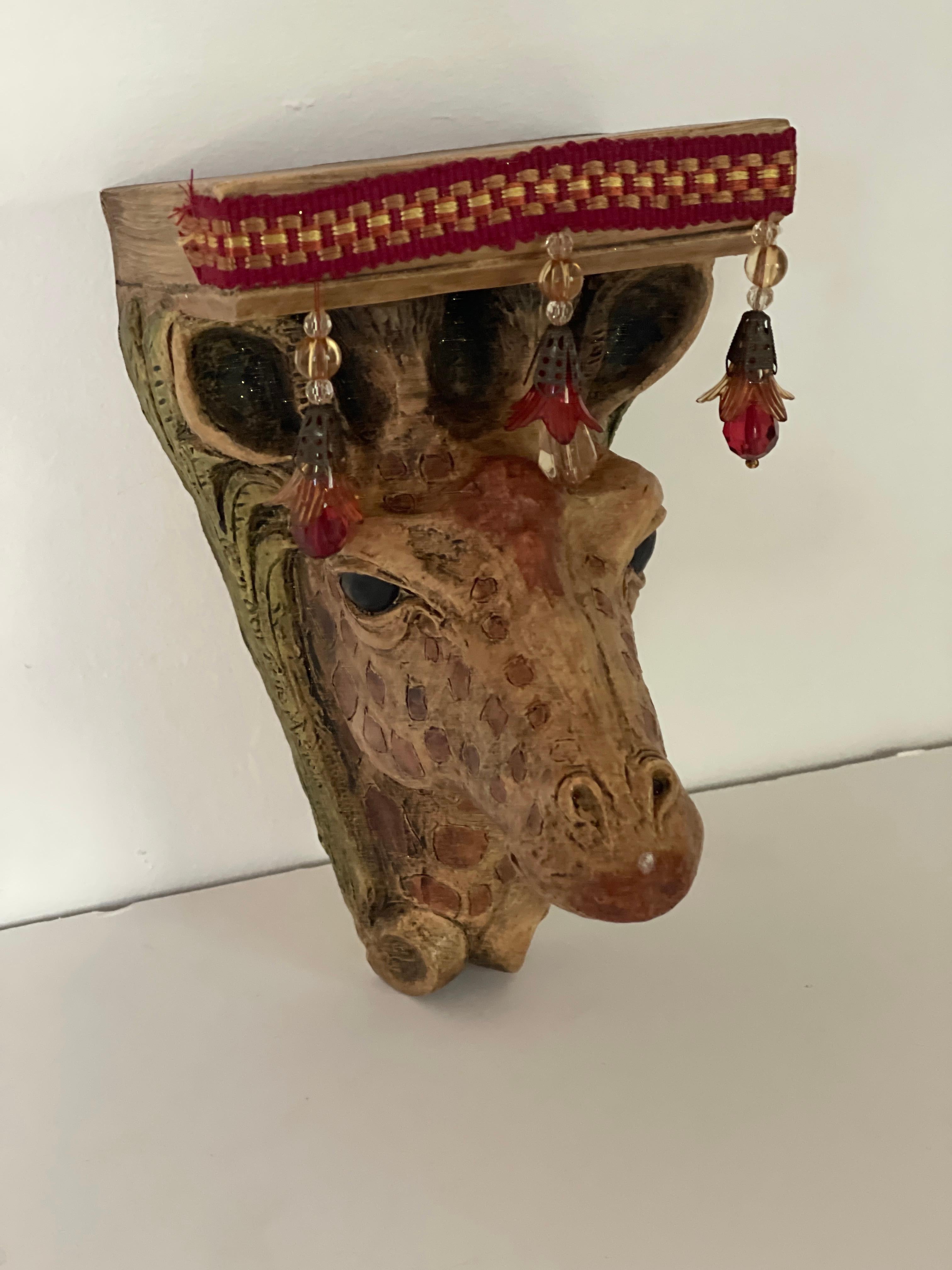 Safari style giraffe head wall bracket set honed by the artist.