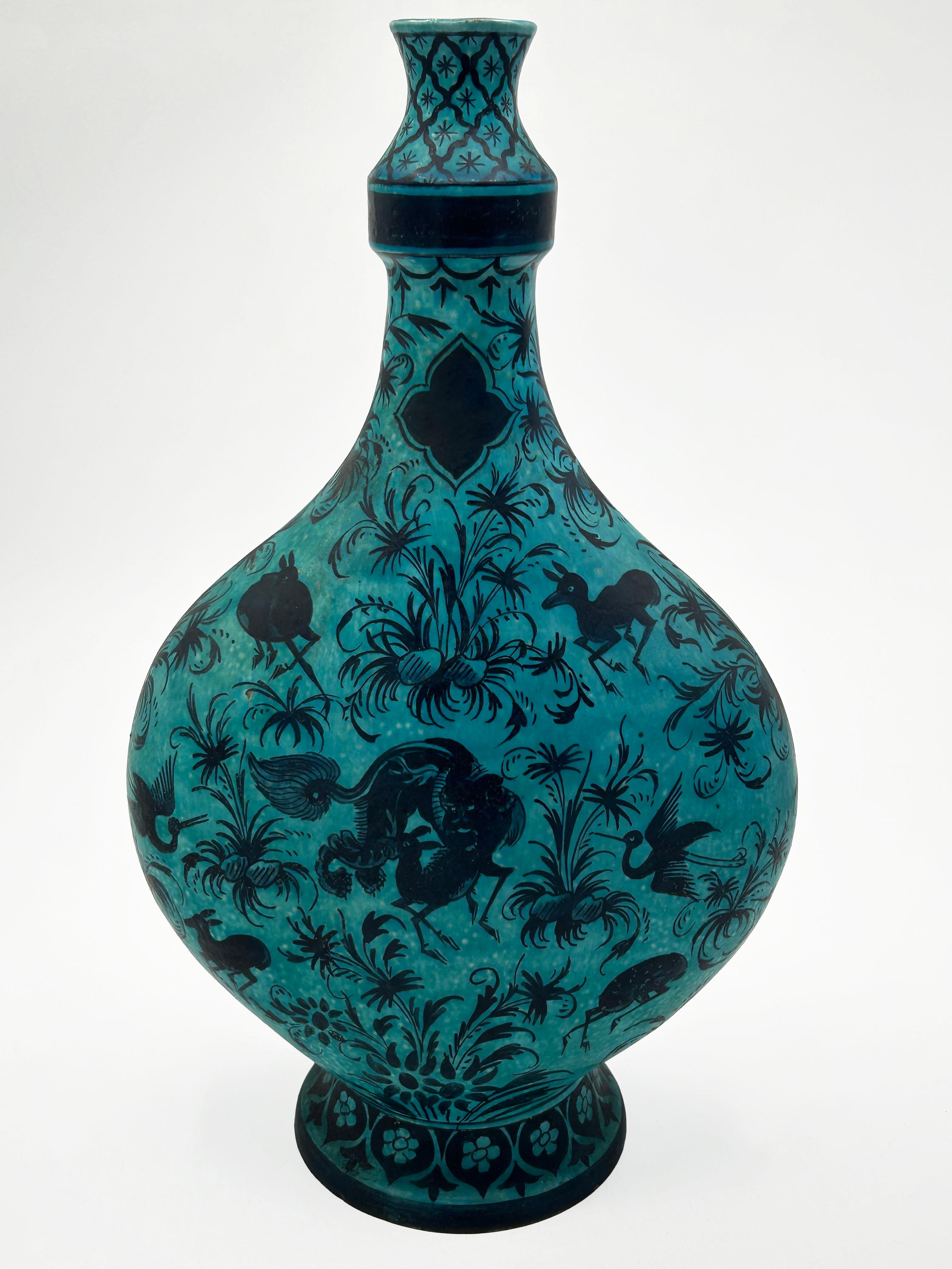 Safavid-style Samson porcelain vase
This ceramic vase features a globular body and elongated neck, rising from a low, flared foot. The piece is distinguished by its dichromatic palette of mottled turquoise as a base and cobalt black decoration