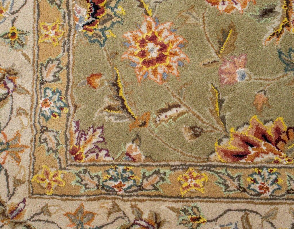 Safavieh manner hand tufted rug, floral patterns on cream field with ornamental border.

Dealer: S138XX