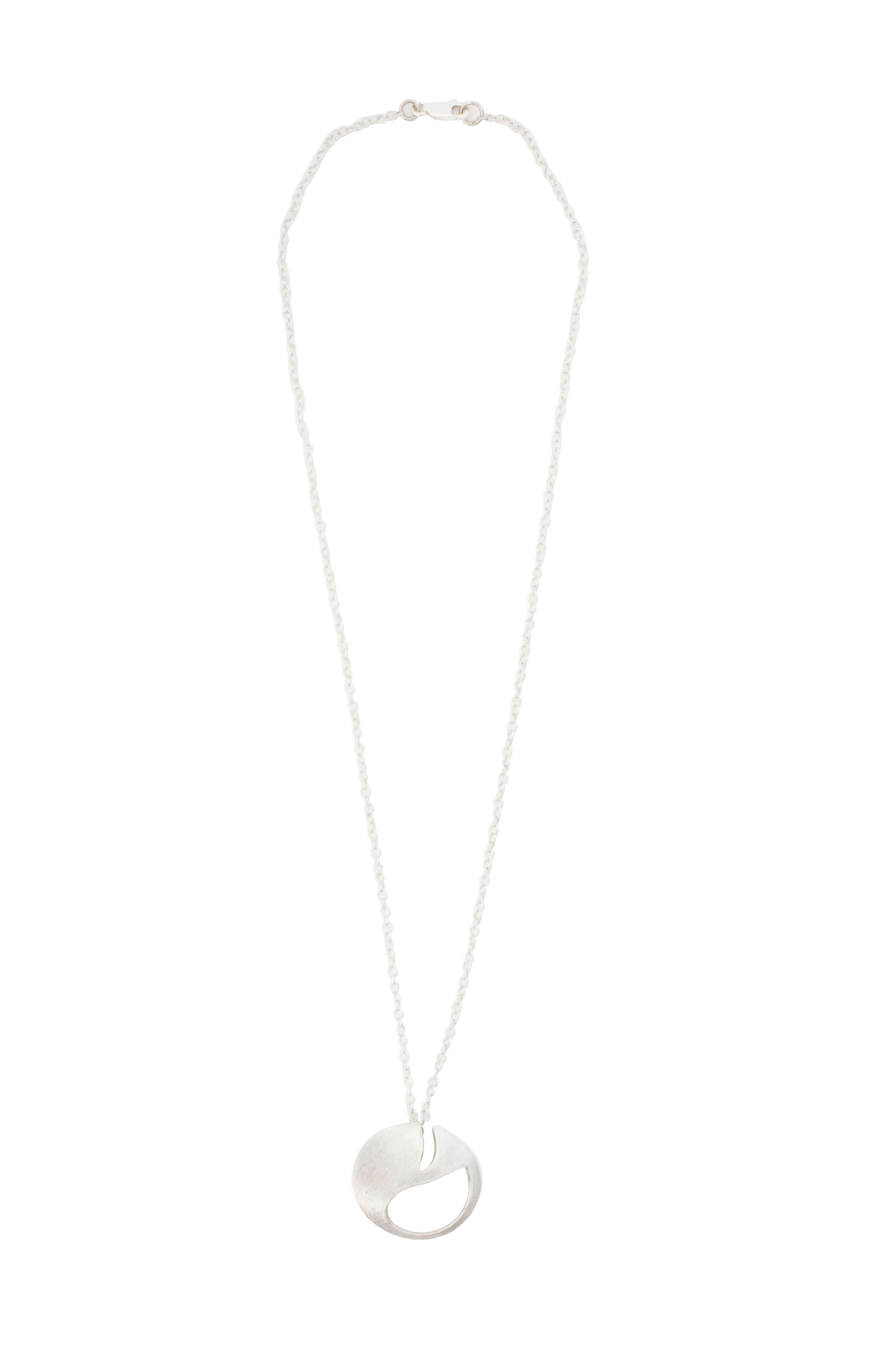 Sterling silver geometric, minimal necklace from our Post Punk collection.

Diameter 3cm
Chain length 48cm

The shape comes from a deformed interpretation of a safety pin head.

