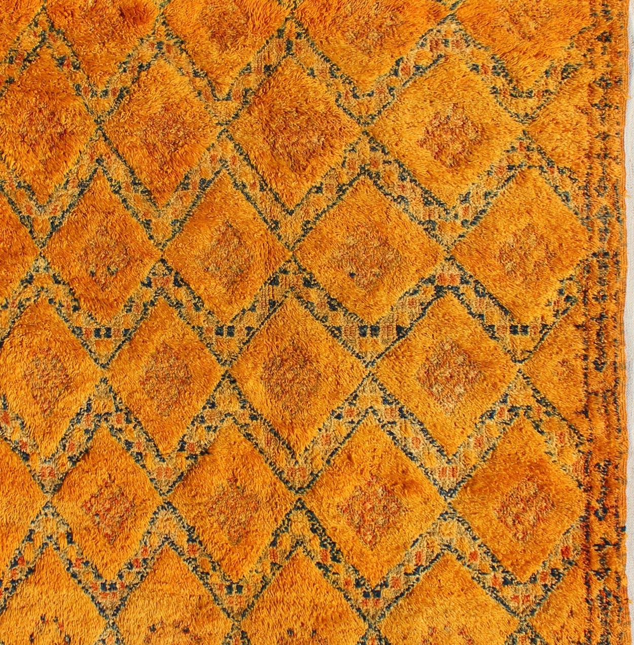 Saffron color antique Moroccan carpet with geometric patterns with charcoal and ivory, Keivan Woven Arts / rug LCB-18-145, country of origin / type: Morocco / Tribal, circa 1920.

Crafted in the early 20th century, this gorgeous Antique Moroccan
