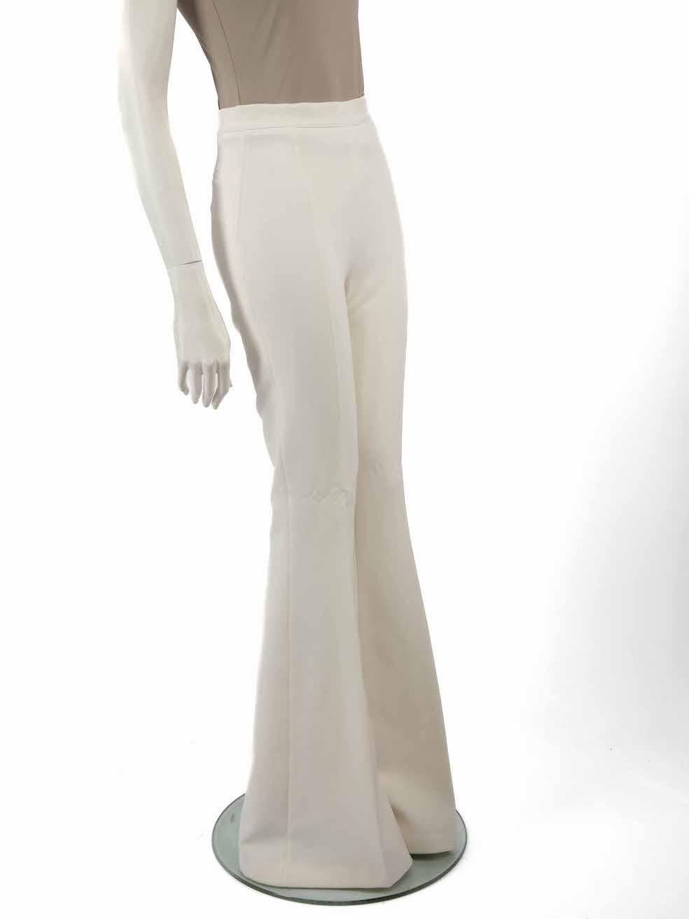 CONDITION is Very good. Minimal wear to trousers is evident. Minimal wear to hems where the fabric has started to pill on this used Safiyaa designer resale item.
 
 
 
 Details
 
 
 White
 
 Polyester
 
 Flared trousers
 
 Long length
 
 High rise
