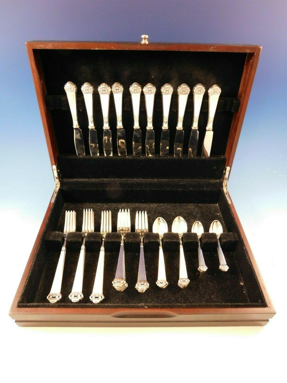 Saga by Mylius Brodrene 830 silver Norwegian flatware set, 50 pieces. The company began in 1932 in Krager, in the south of Norway and closed its doors in 2008. This pattern has a pierced finial on a plain squared handle. This set includes:

 10