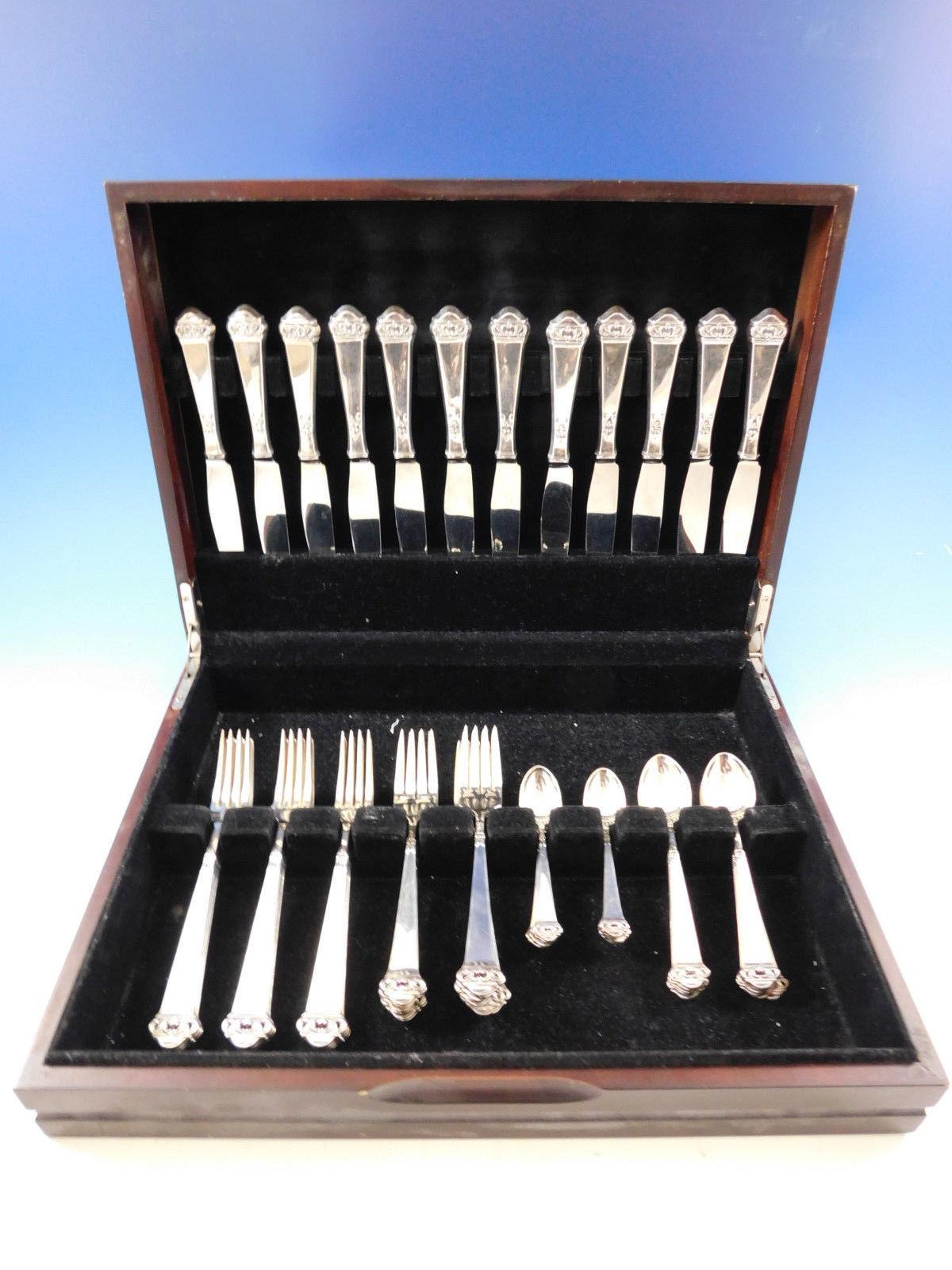 Saga by Mylius Brodrene 830 silver Norwegian Flatware set, 60 pieces. This set features pierced handles and includes:

12 knives, 8