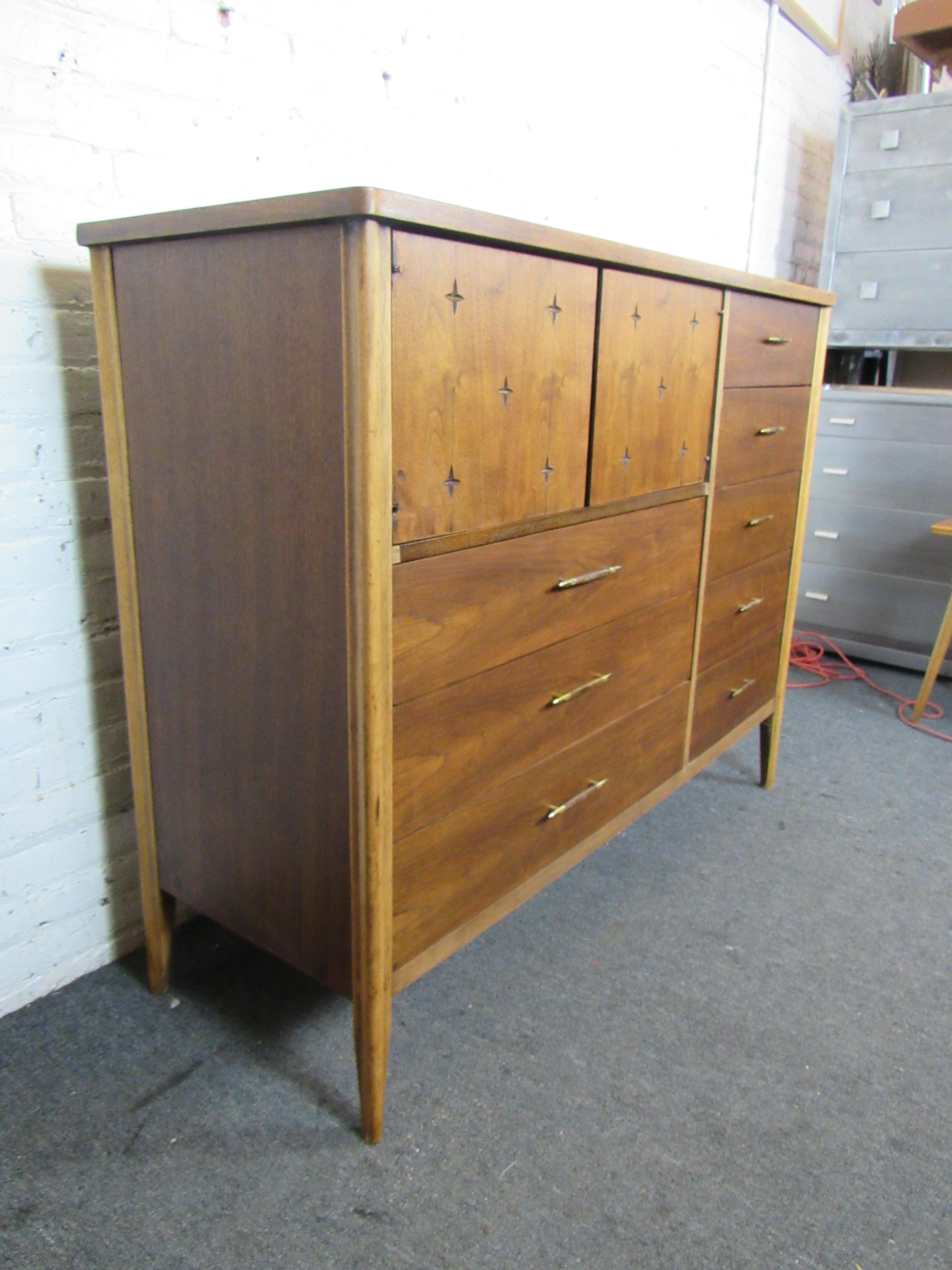 Unique chest of drawers from American makers, Broyhill Premier. Features interesting designs on cabinet section and great looking brass handles. 
(Please confirm item location - NY or NJ - with dealer).
 