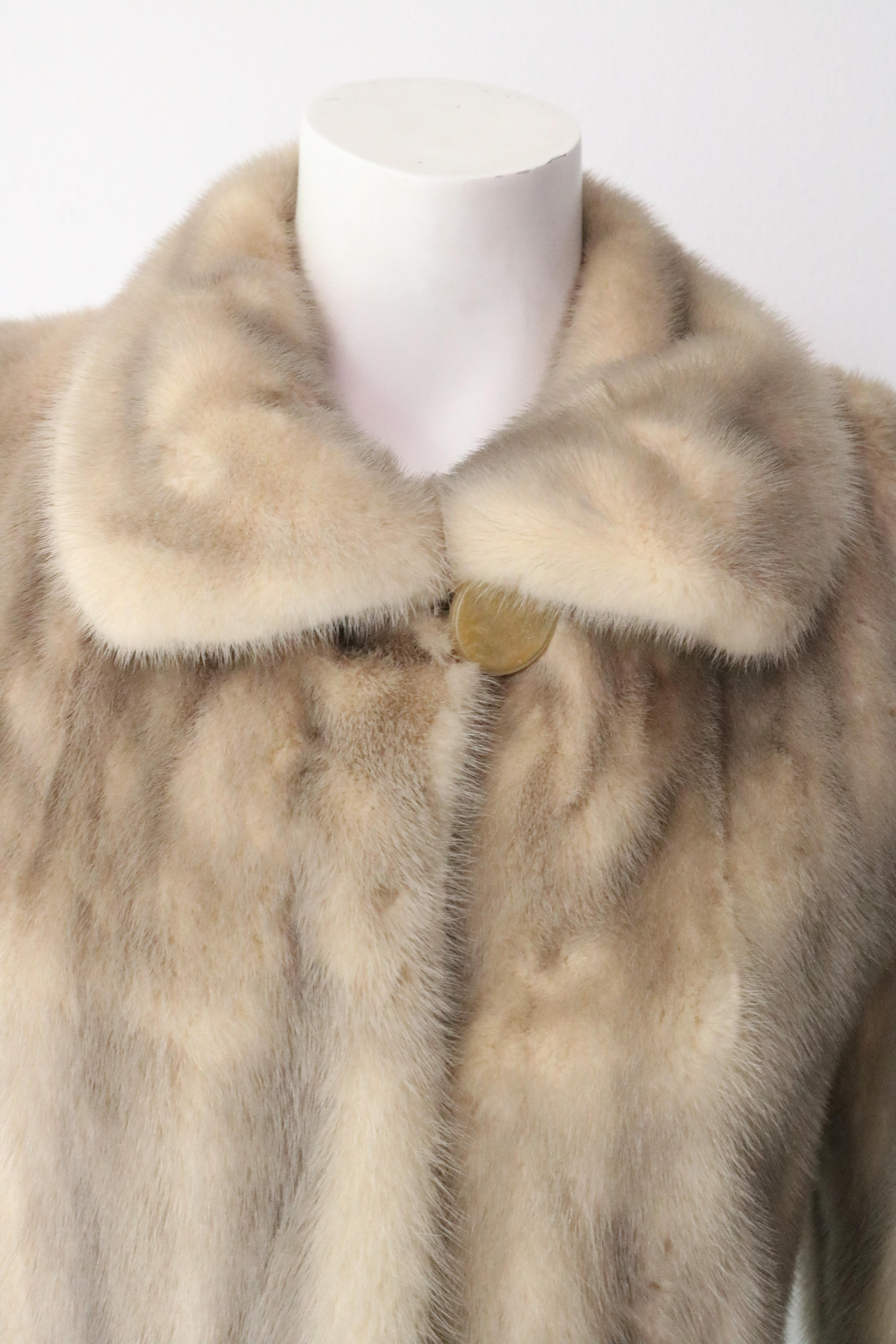 BEAUTIFUL Mink Carmel and Blonde colored fur jacket. 
Size 4 
Mid Length 
Vintage - Great condition. 
Small tear in underarm (see photo) 