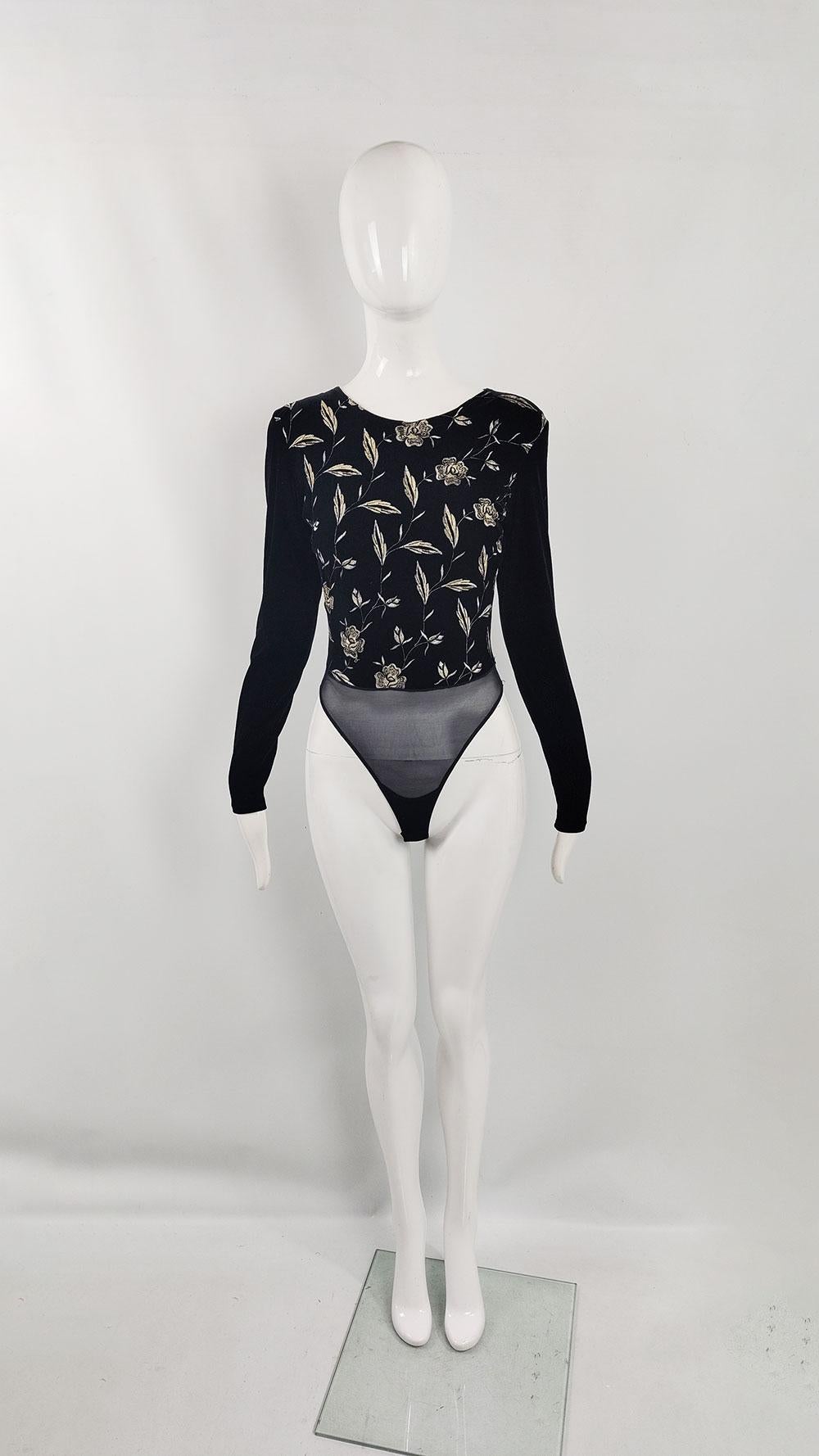 A fantastic vintage women's bodysuit from the late 90s /early 2000s by the French label Sagaie Paris. Made from black velour, it features long sleeves and exquisite pale gold floral embroidery on the front. An ideal choice for parties.

Size: Marked