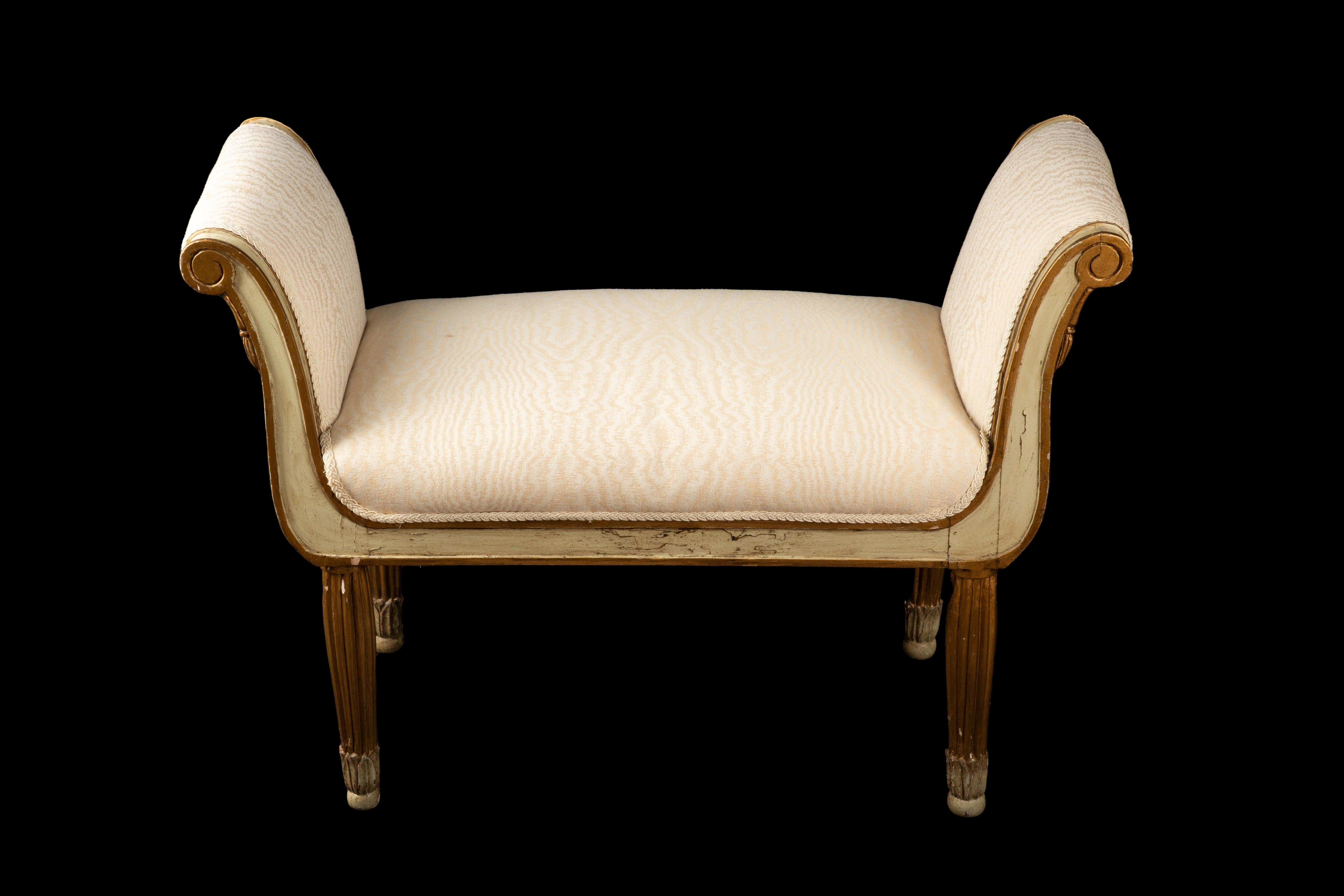  Stunning Italian bench from the 1920s, adorned in a captivating sage hue with intricate gilt accents. This exquisite piece effortlessly encapsulates the elegance and charm of the Roaring Twenties era. Crafted with meticulous attention to detail,