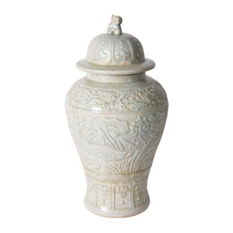 Sage green embossed fish temple jar

The special antique process makes it looks like a piece of art from a museum. 
High fire porcelain, 100% hand shaped, hand painted. Distress, chips and other imperfections create great characters of this