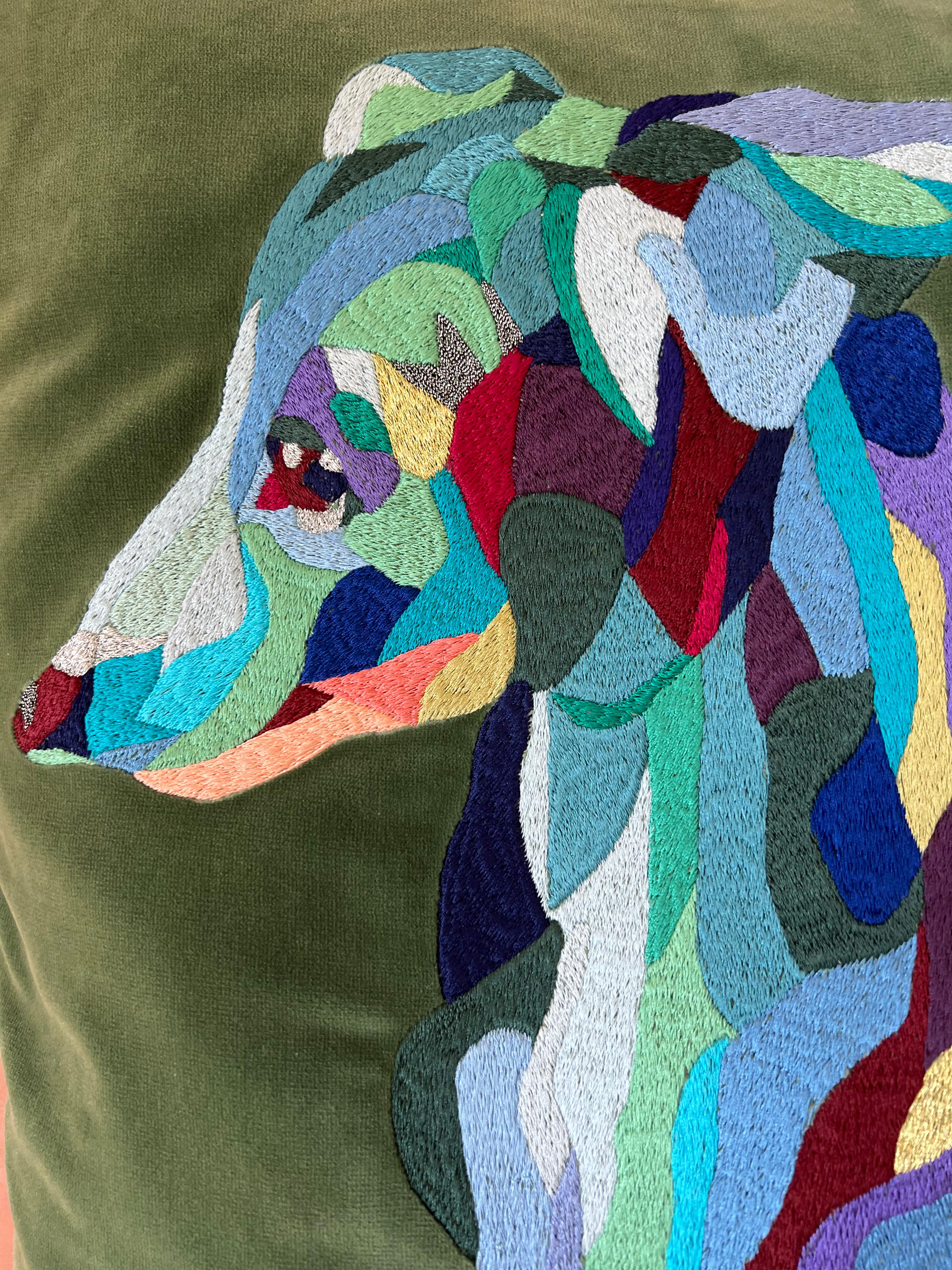 The Italian Greyhound dog, one of my favorite feline subjects, is finely embroidered with colorful silk threads: rich blue tones are assembled into a dynamic and edgy portrait on sage colored velvet fabric. Tonal twisted piping and tassels embellish