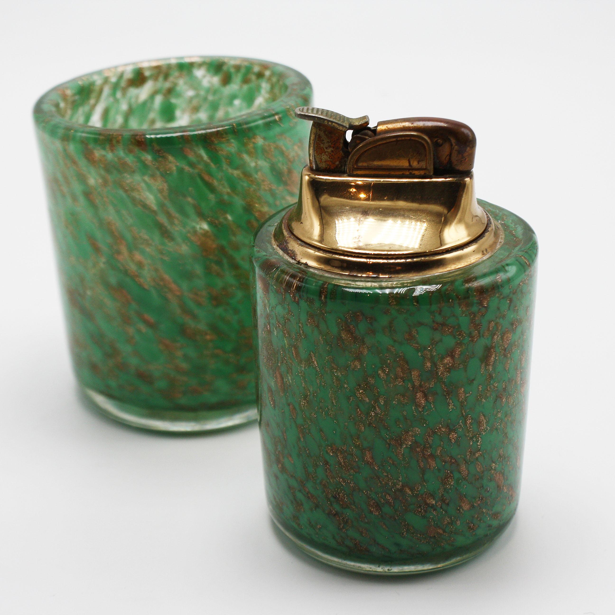 Sage green Murano glass lighter & holder, circa 1960.
$425

Lighter: 2 1/4”D X 3 3/4”H

Holder: 2 5/8”D X 3”H