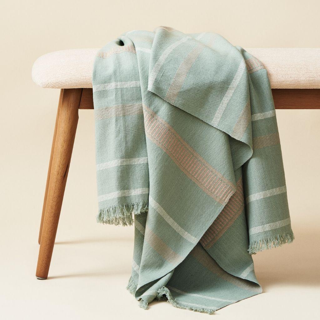 Custom design by Studio Variously, Sage is a organic cotton bedspread handwoven by master weavers in Nepal.

A sustainable design brand based out of Michigan, Studio Variously exclusively collaborates with artisan communities to restore and revive