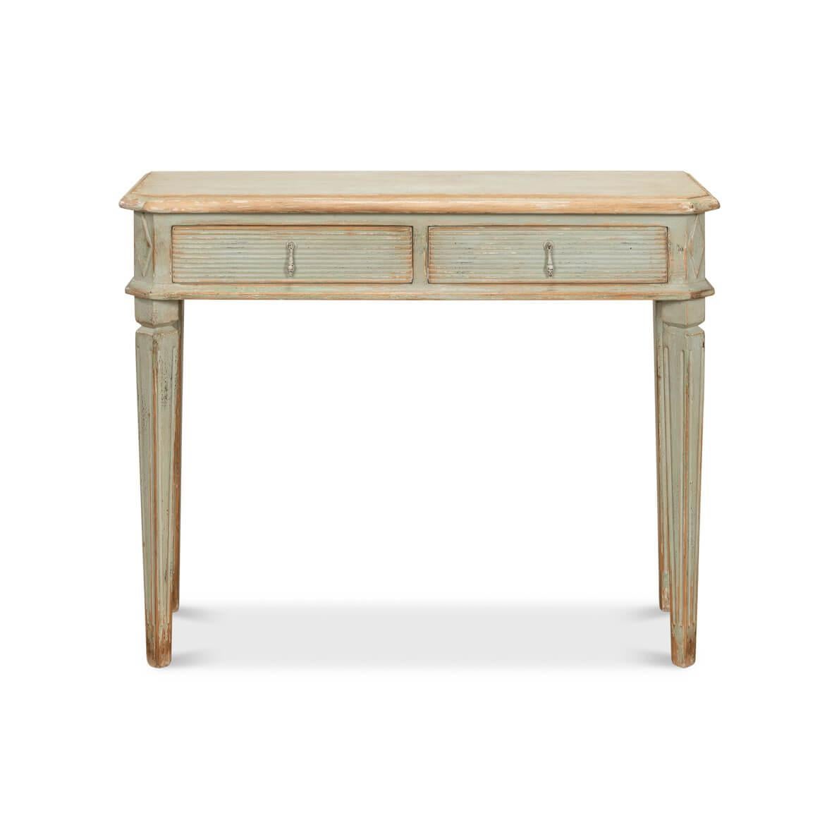Crafted with loving attention to detail, this table boasts a soft, sage-painted distressed finish, evoking the tranquil essence of time passed in a serene countryside.

The slender, tapered legs set on an angle provide a graceful foundation, while