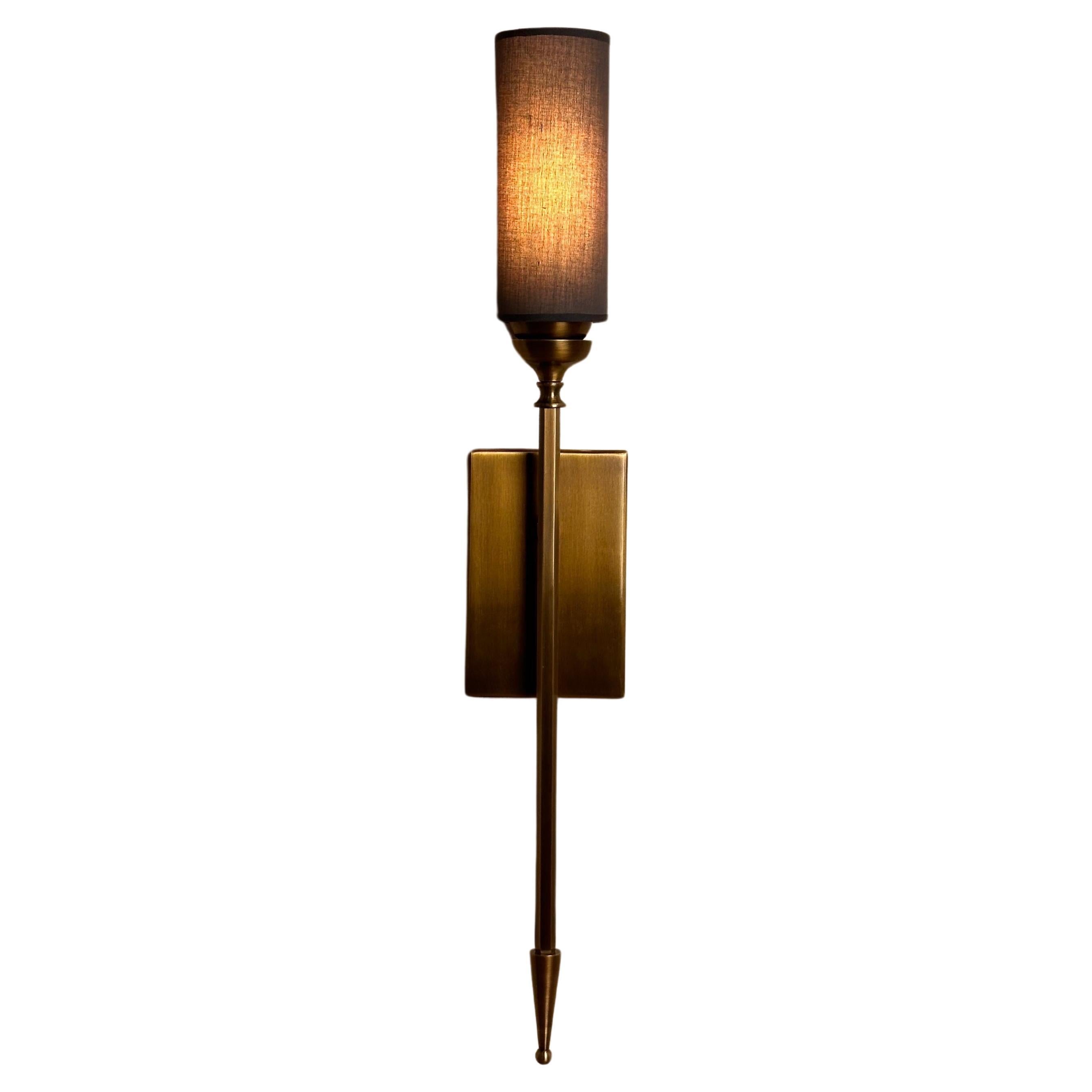 SAGOVIA Shade brass wall lighting is a stunning representation of Mid-Century Modern style, meticulously crafted to add a touch of elegance and sophistication to any space. This exceptional wall sconce is expertly designed, featuring a cylindrical