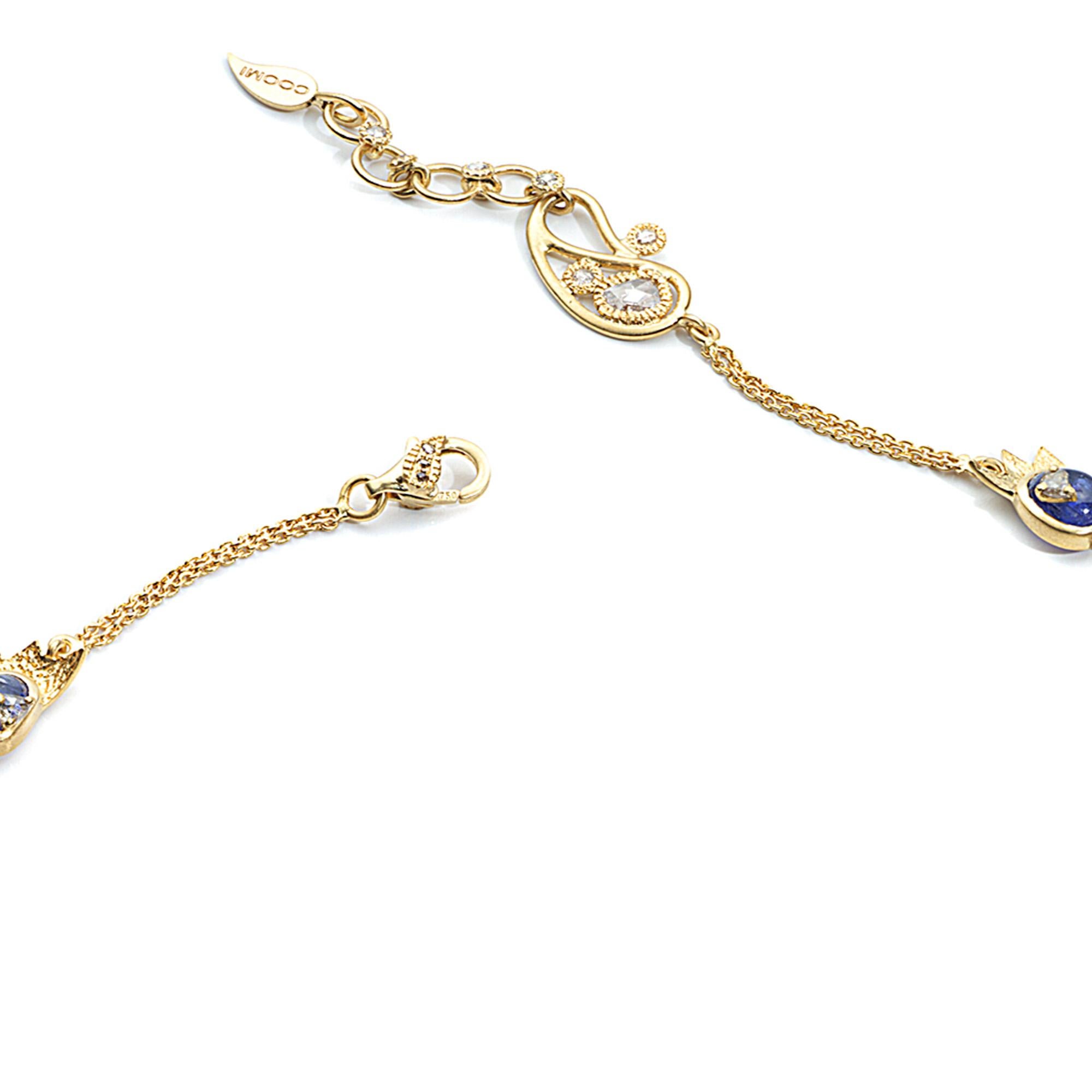 Sagrada Crescent Necklace Set in 20 karat Yellow Gold with 2.91-carat Diamonds and 27.20-carat Tanzanite. 
