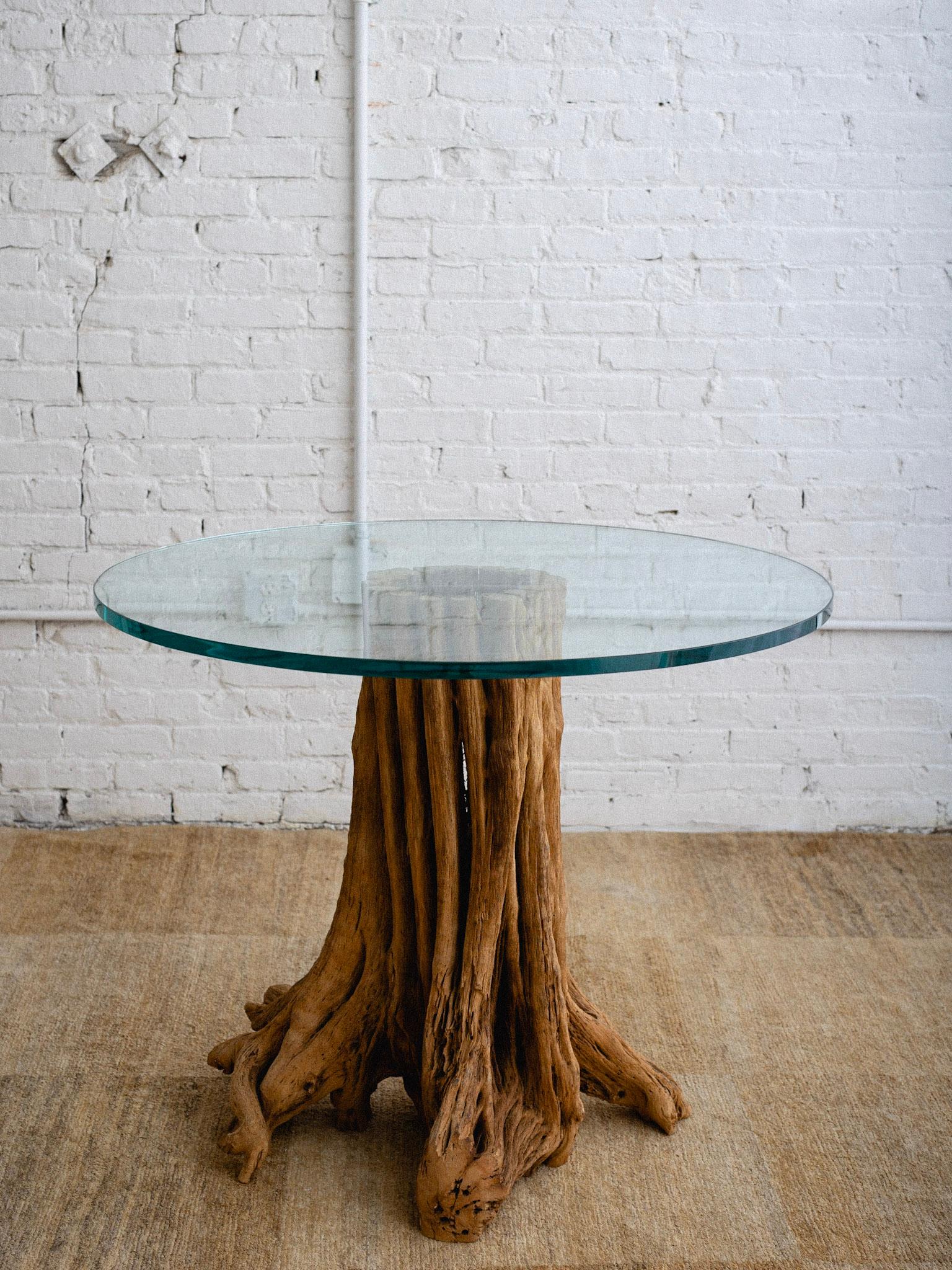 A vintage saguaro cactus dining table. A solid wood pedestal crafted from the lower portion of a saguaro cactus “skeleton.