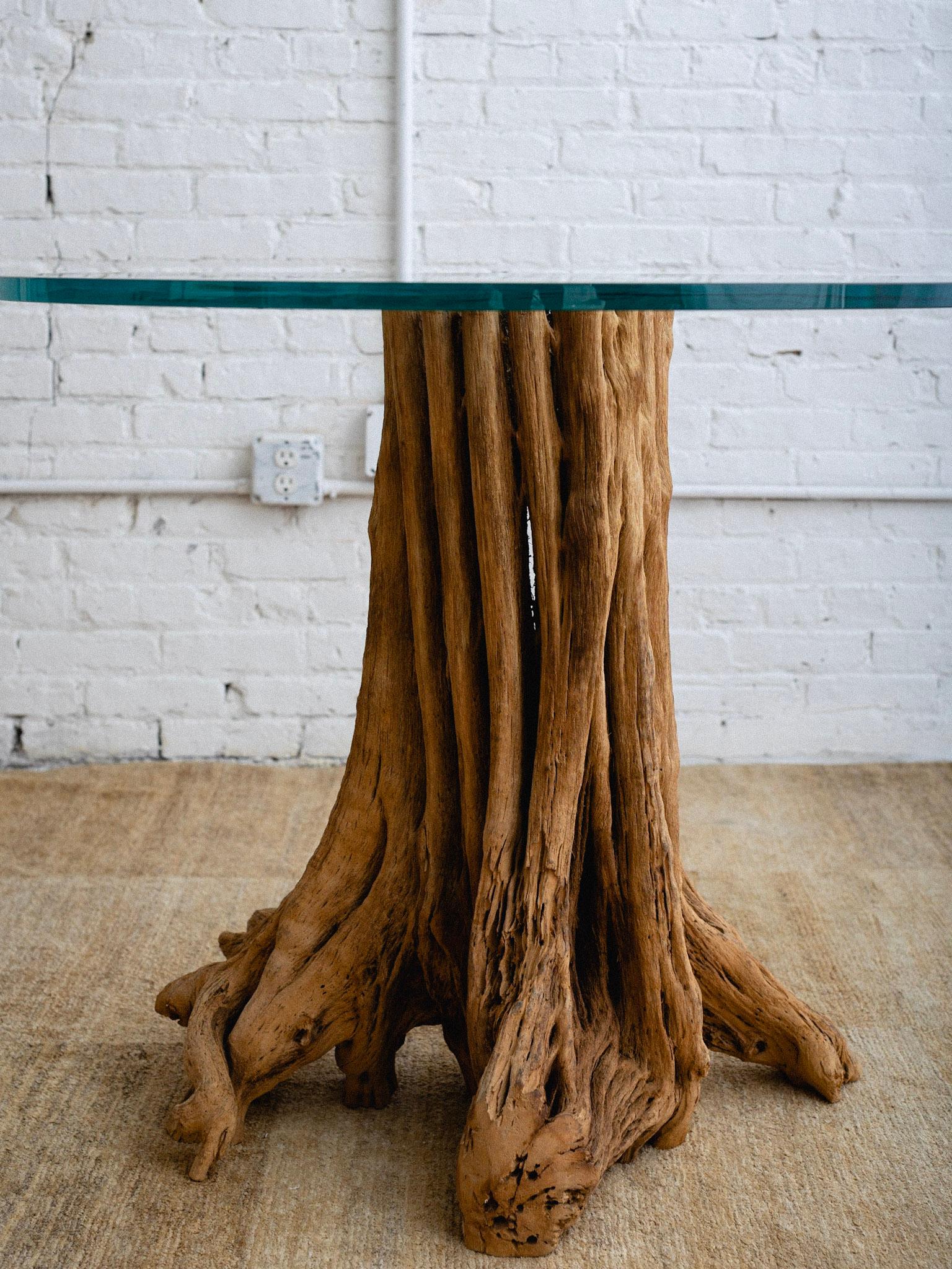 glass dining table with tree trunk base