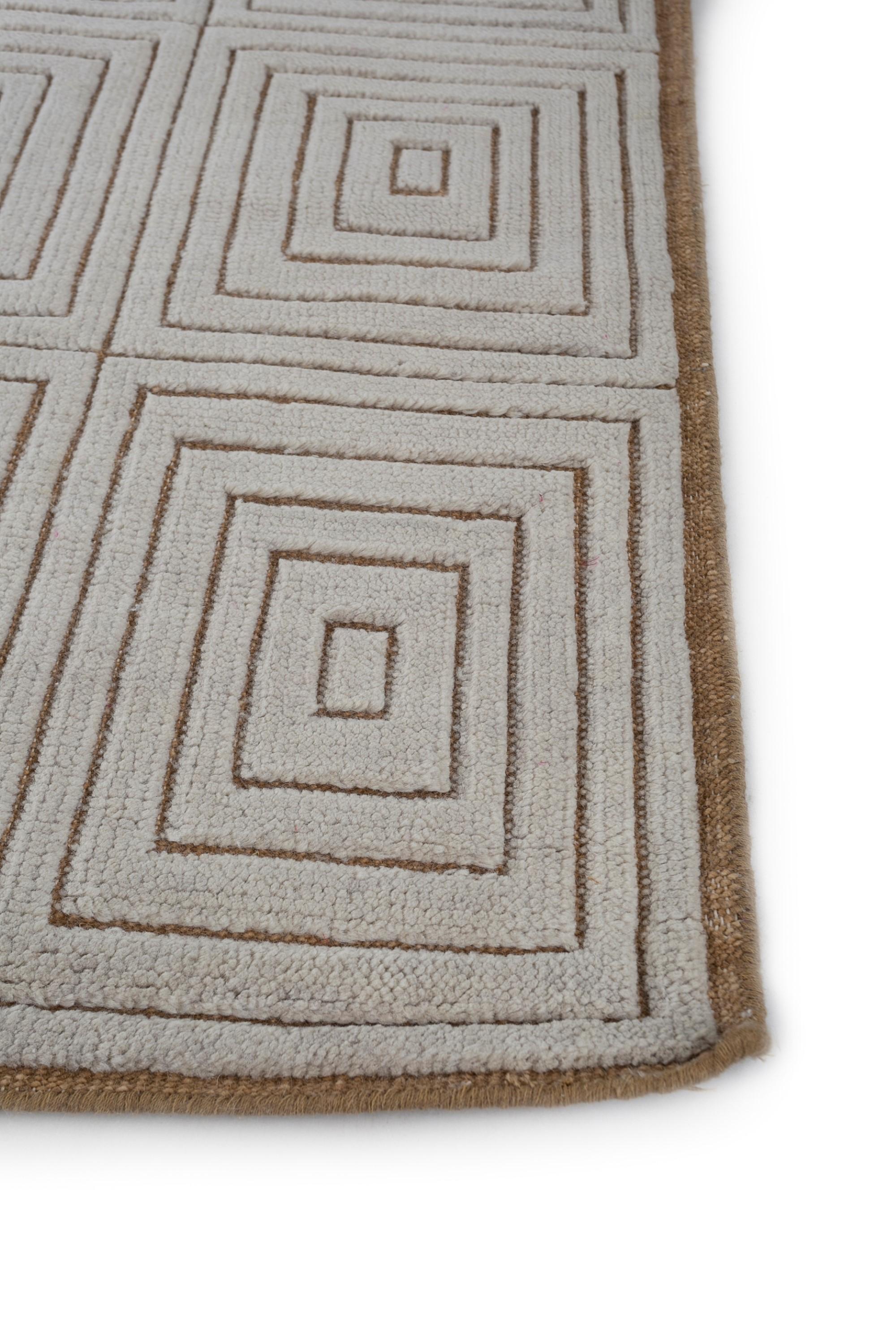 An exquisite tapestry of Moroccan inspiration and contemporary allure ! Crafted with an all-wool construction in rural India, this handknotted rug transforms eclectic patterns into a modern aesthetic masterpiece. Like an artist's brush on a canvas,