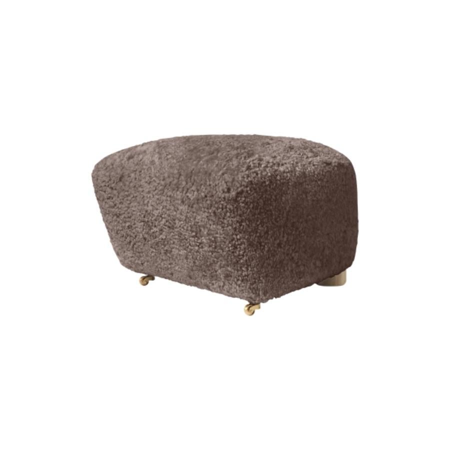 Sahara natural oak sheepskin the tired man footstool by Lassen.
Dimensions: W 55 x D 53 x H 36 cm 
Materials: Sheepskin

Flemming Lassen designed the overstuffed easy chair, the tired man, for The Copenhagen Cabinetmakers’ Guild Competition in