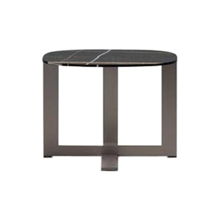 Domino Next Coffee Table by Nicola Gallizia. Expert-crafted in Italy exclusively by Molteni&C. 

Offering complexity and a distinctive color palette, the Domino rounded coffee table adds a touch of glamour in Sahara Noir marble with natural gold and