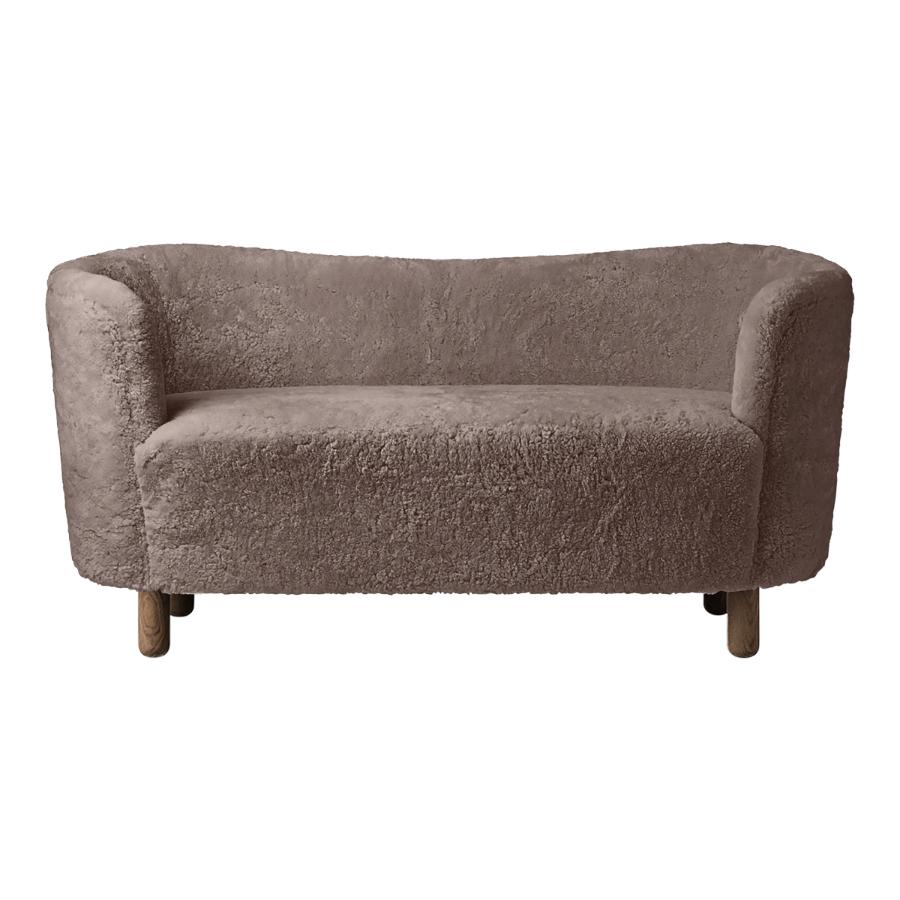 Sahara sheepskin and smoked oak mingle sofa by Lassen
Dimensions: W 154 x D 68 x H 74 cm 
Materials: Sheepskin, oak.

The Mingle sofa was designed in 1935 by architect Flemming Lassen (1902-1984) and was presented at The Copenhagen