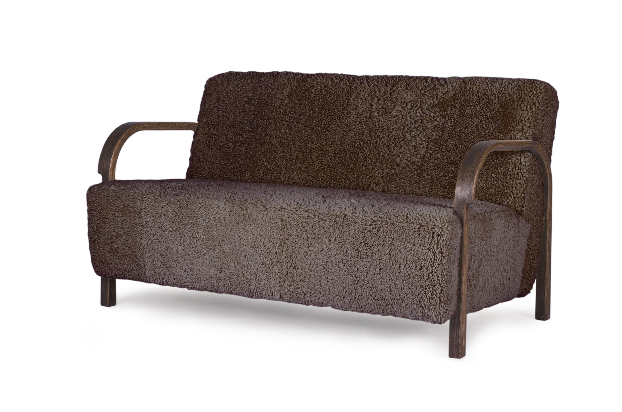 Sahara Sheepskin ARCH 2 seater sofa by Mazo Design
Dimensions: W 128 x D 79 x H 76 cm
Materials: Oak, Sheepskin
Also Available: 2 Seater Configuration, ROMO/Linara, DAW/Royal, KVADRAT/Remix, KVADRAT/Hallingdal & Fiord, BUTE/Storr, DEDAR/Linear,