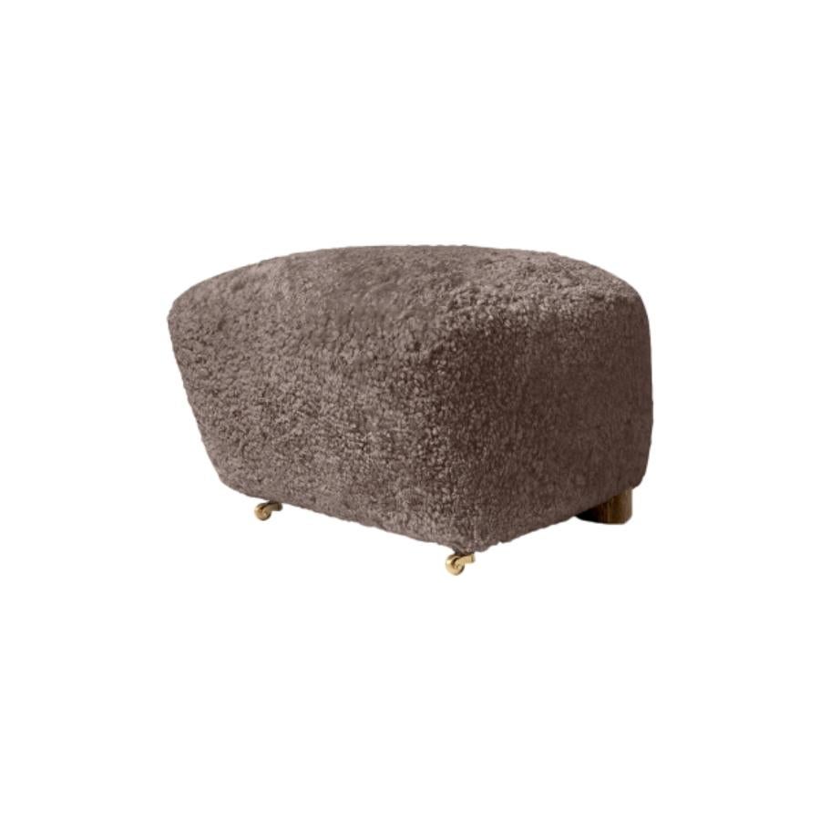 Sahara smoked oak sheepskin The Tired Man footstool by Lassen
Dimensions: W 55 x D 53 x H 36 cm 
Materials: Sheepskin

Flemming Lassen designed the overstuffed easy chair, The Tired Man, for The Copenhagen Cabinetmakers’ Guild Competition in