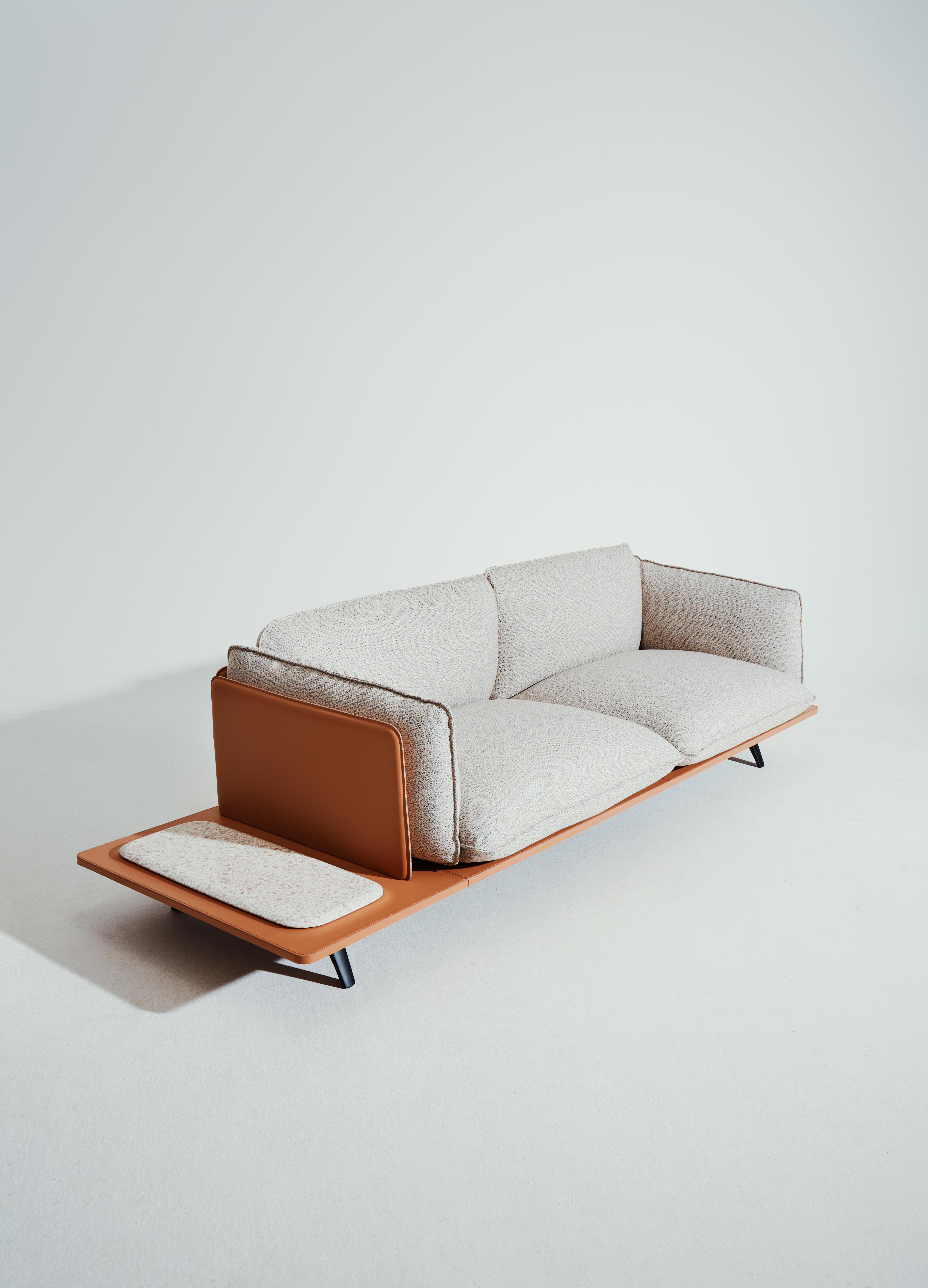 Sahara sofa by Noé Duchaufour Lawrance
Modular sofa 2 seats + top
Dimensions: W 273.8 x W 87.9 x H 83 cm
Materials: Fabric or leather, Black aluminium, powder coat structure, Mdf lacquered base, Leather back panels

The design of the ‘Sahara’