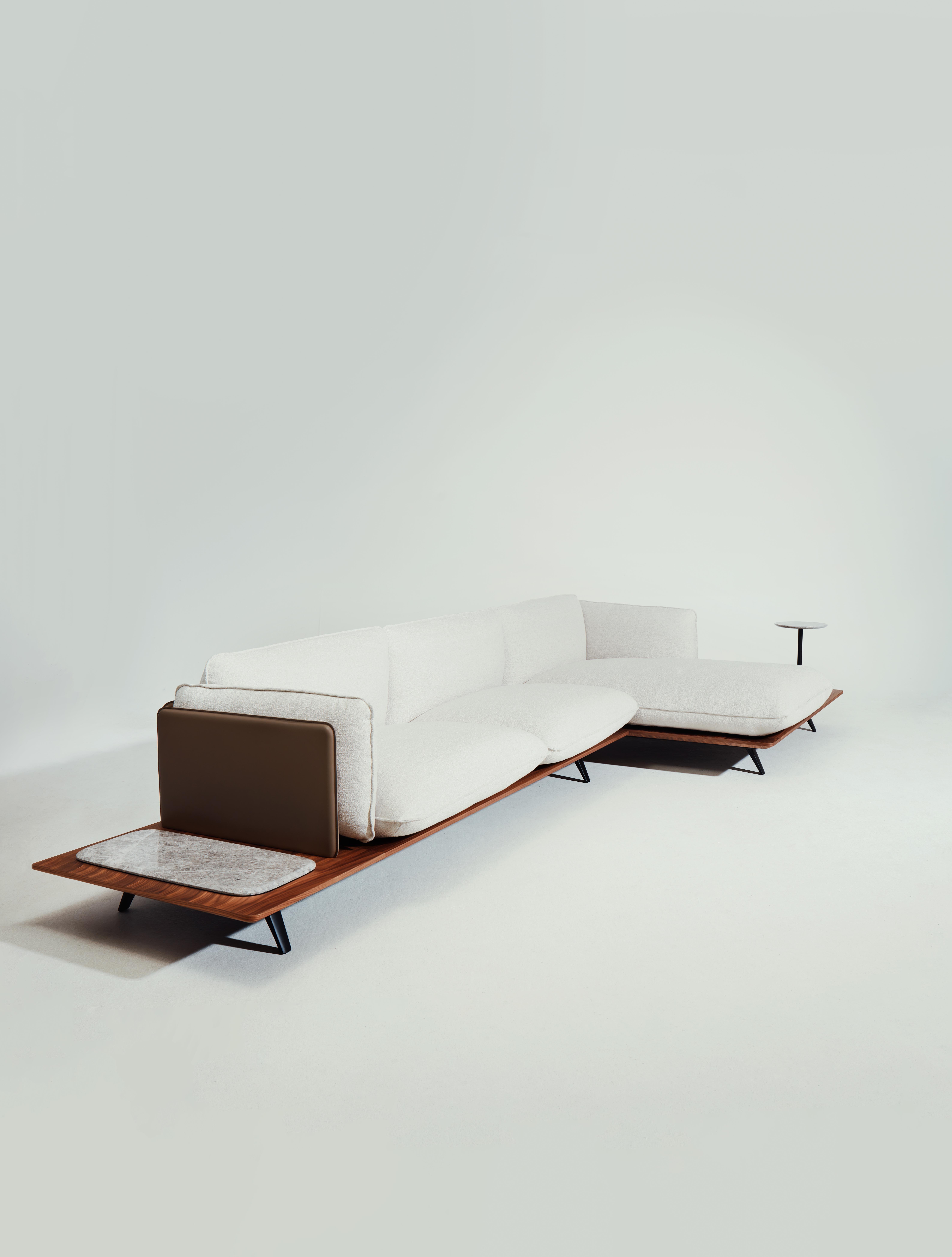 Sahara sofa by Noé Duchaufour Lawrance
Sofa 3 seats + 2 tops
Dimensions: W 416.3 x D 158.5 x H 83.8 cm
Materials: Leather or fabric, black aluminium powder, coat structure, wood base, leather back panels.

The design of the ‘Sahara’ sofa evokes