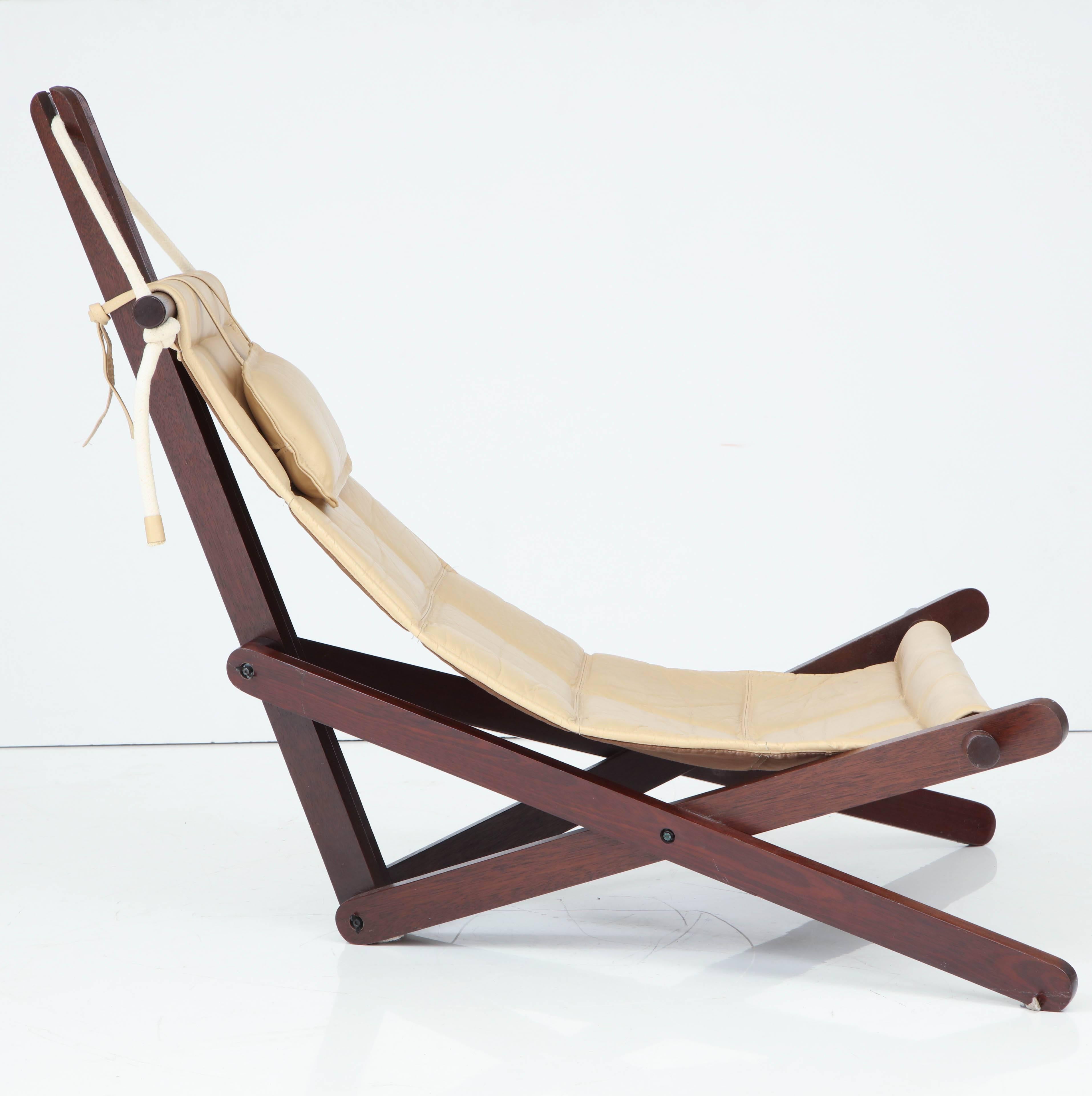 Intricate designed cream colored leather and jatoba wood sling chair by English Architect Dominic Michaelis called the 