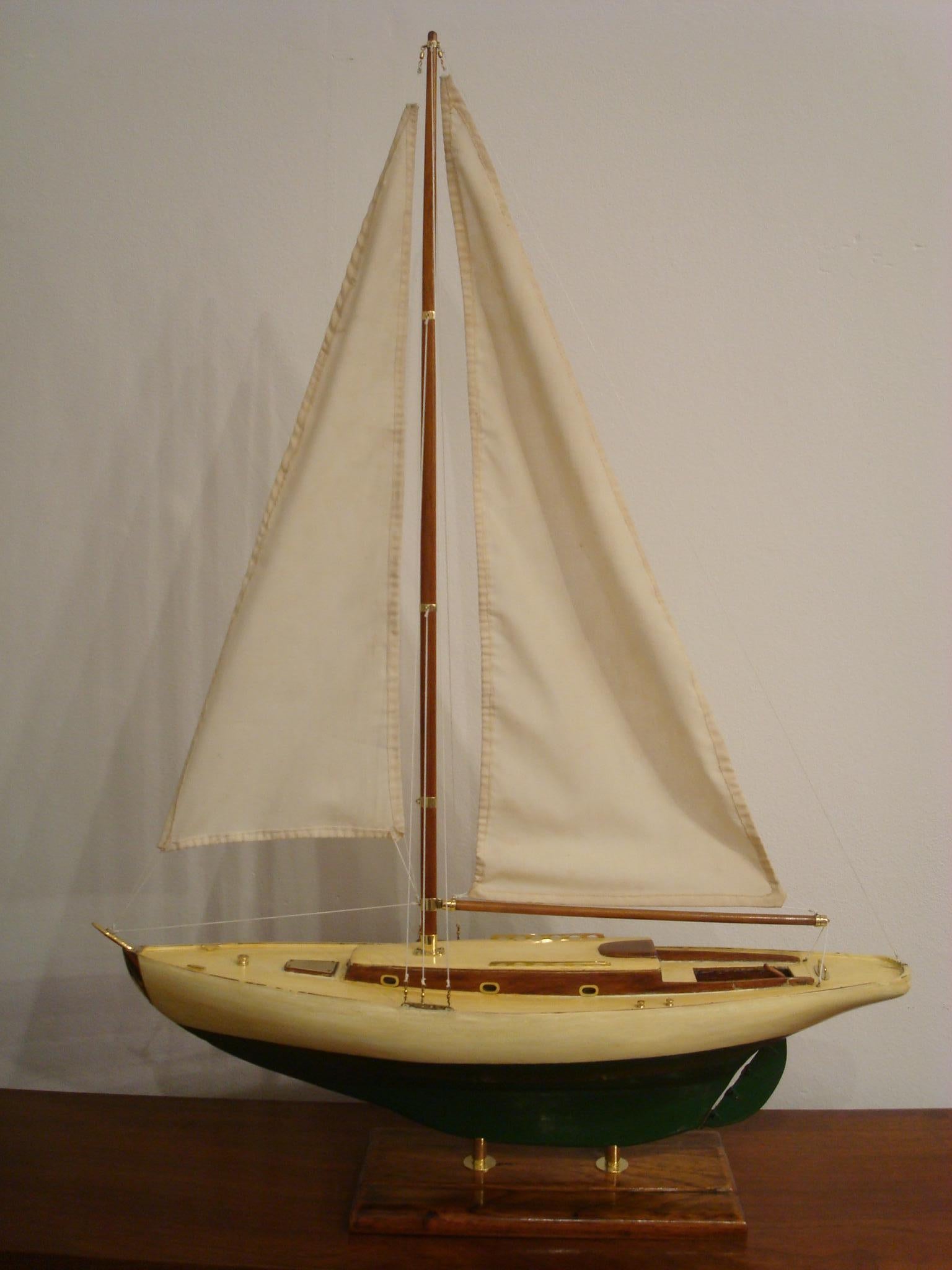 Sailboat model on stand. Painted wood body and bronze accessories.
Made between 1920s-1930s. Very nice restored conditions.
Very decorative item, perfect for any nautical fan.

               
