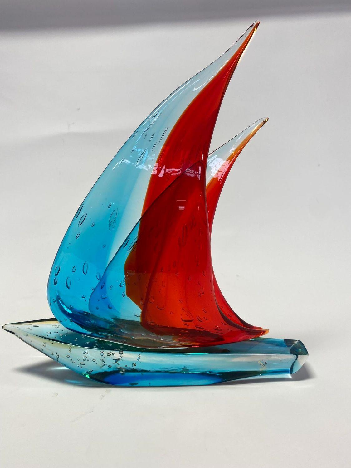 Vintage Italian double sail boat hand blown and crafted in blue and red Murano glass by Sergio Costantini Signed on the base / Made in Italy in the 1960’s
Height: 20 inches / Width: 17.5 inches / Depth: 3.5 inches