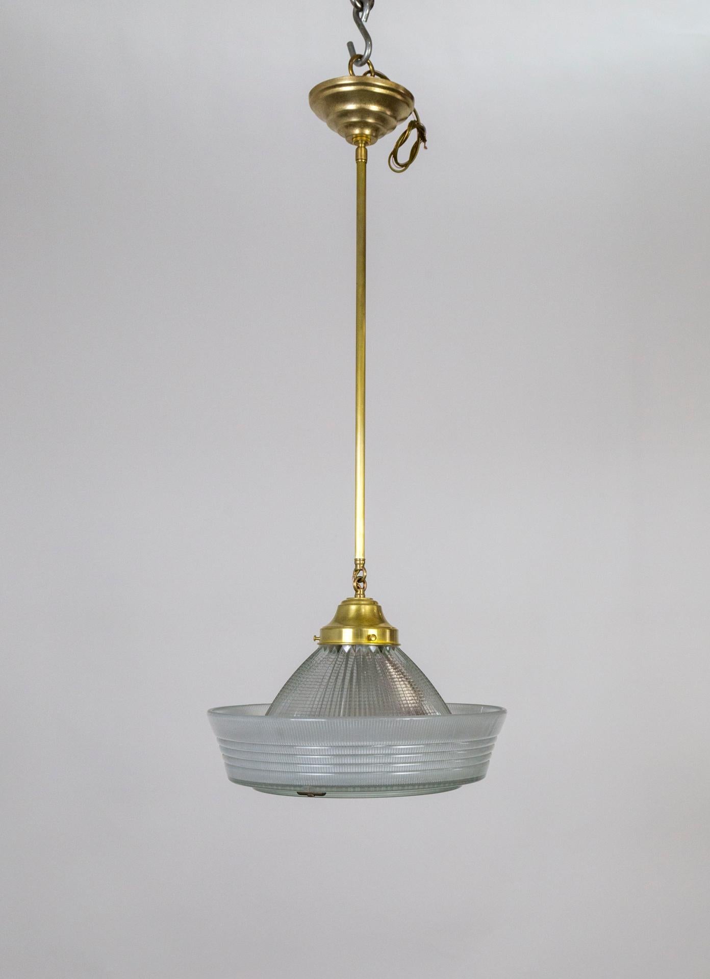 A holophane glass shade in a sailor hat shape with removable under plate, as a pendant light; newly made with a brass holder and long stem. 