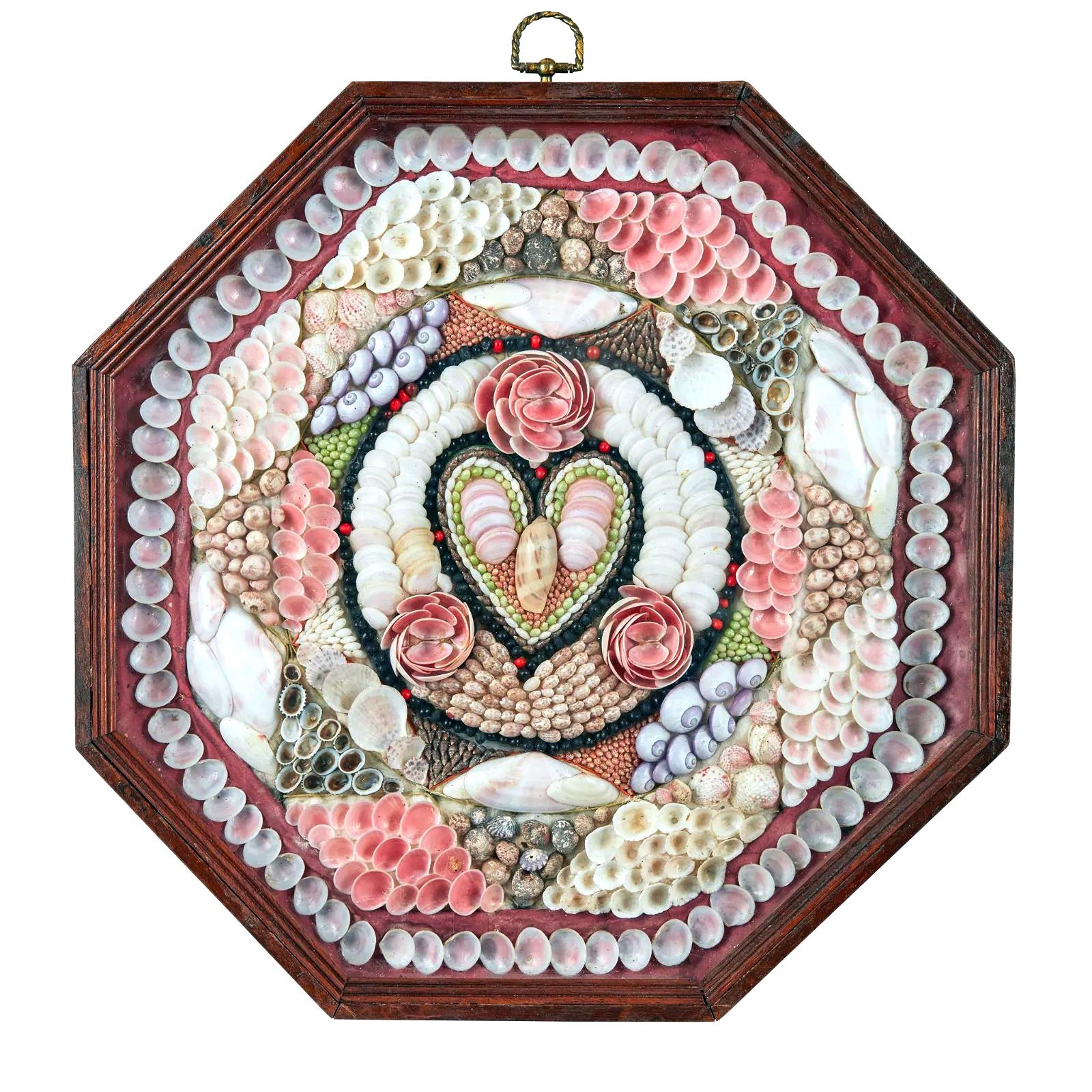 West Indian Sailor's Valentine,
Circa 1880

The large single sailor's valentine is composed from a variety of shells in concentric and geometric patterns, centred with a heart motif, surrounded by three flowers; within an octagonal stained wood