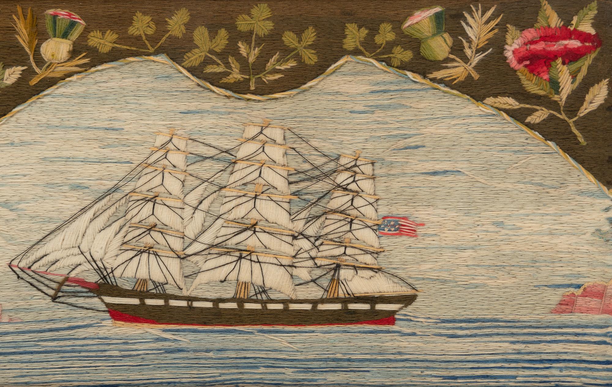 Sailor's Woolwork of an American Ship,
Circa 1875.

The unusual sailor's woolie or woolwork depicts an American three-masted ship under full sail within a fan-shaped panel with the section above embroidered like Berlin woolwork with patriotic