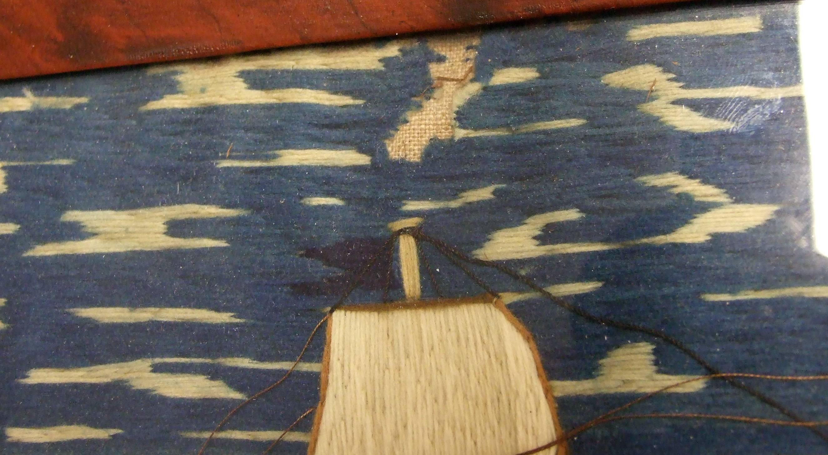 Sailor's woolwork of HMS Nankin,
Berlin wool on linen,
circa 1865.

A lovely sailor's woolwork or woolie picture depicting the 4th Rate HMS Nankin under full sail flying the blue ensign as she passes a fortification flying the Union Jack and an