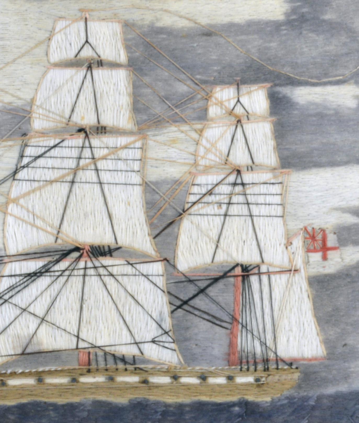 English Sailor's Woolwork of a Royal Navy Frigate,
circa 1870.

The sailor's woolie depicts a portside view of a Royal Navy Frigate flying the White Ensign from the Mizzenmast. The ship is coming into port with the tide and a lighthouse and